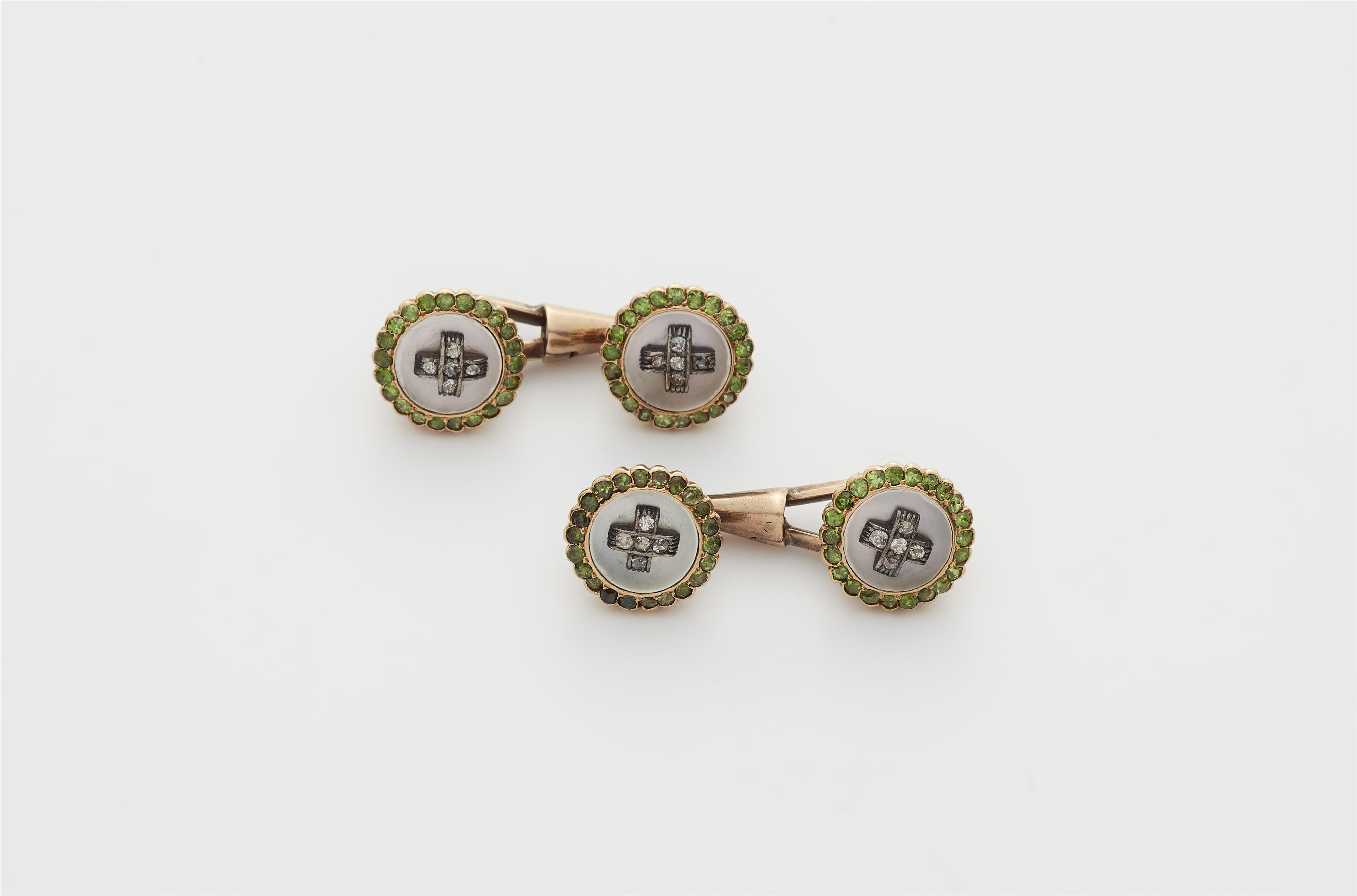 A pair of Austrian mother of pearl diamond and demantoid cufflinks. - image-1