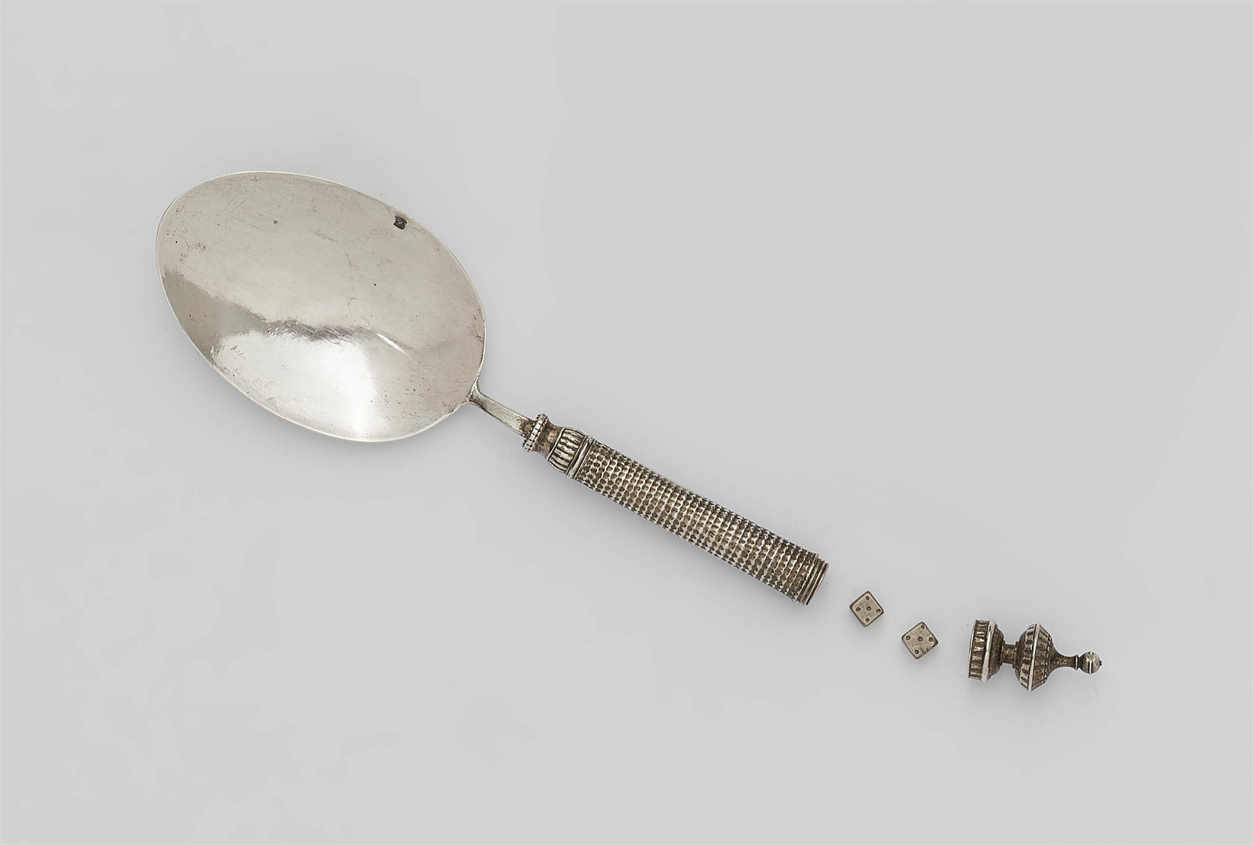 A silver spoon with screw mounted compartment - image-1