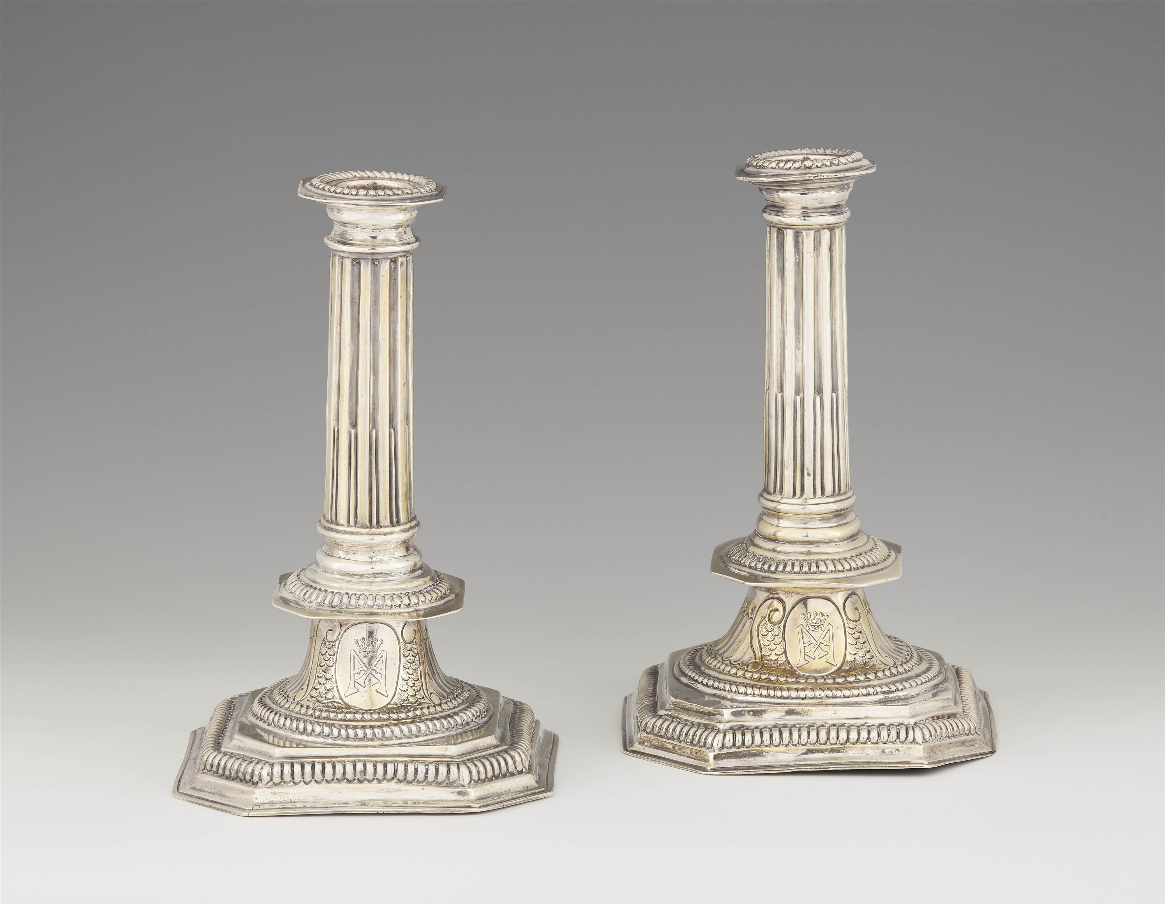 A pair of Queen Anne silver candlesticks - image-1