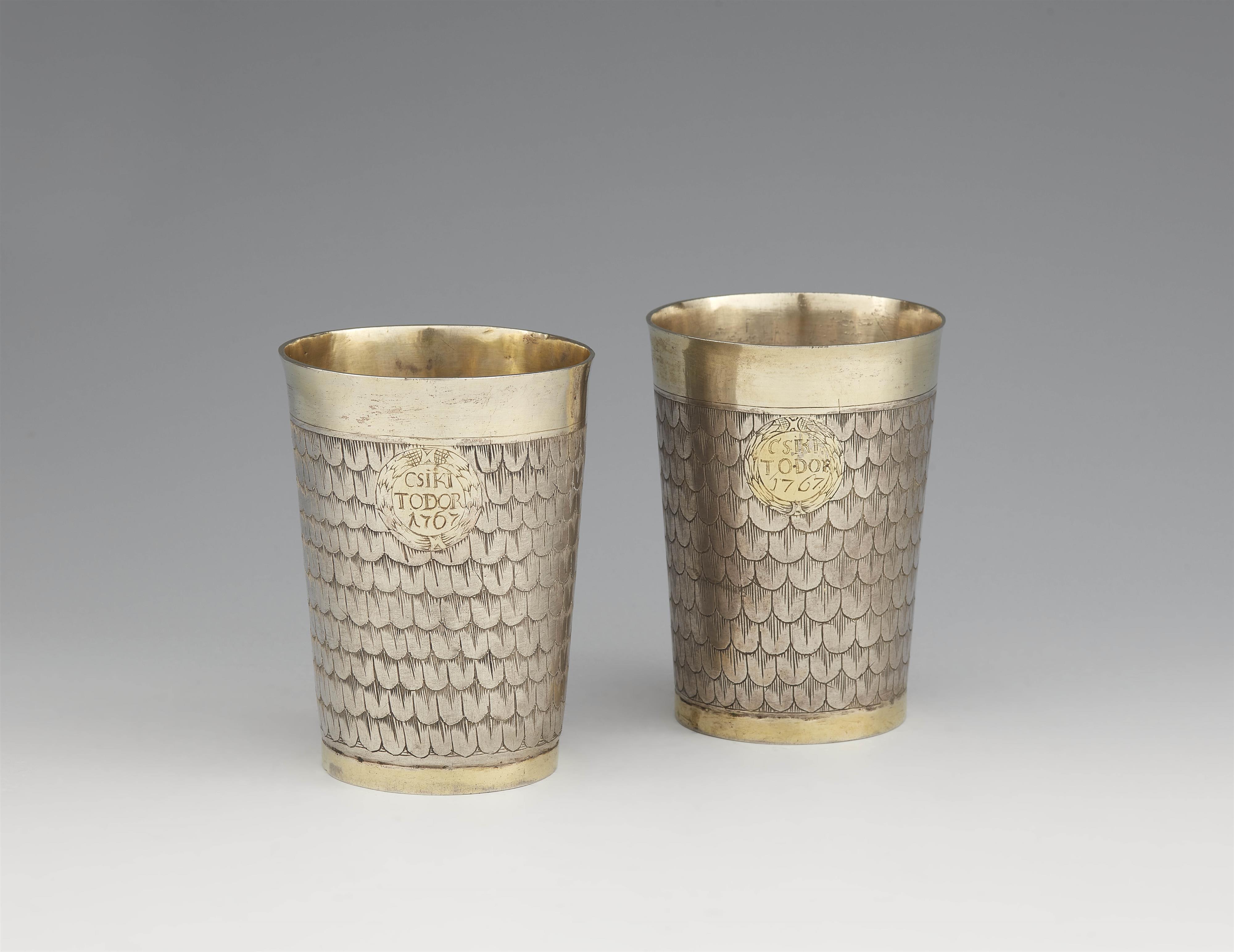 Two Transylvanian parcel gilt silver beakers - image-1