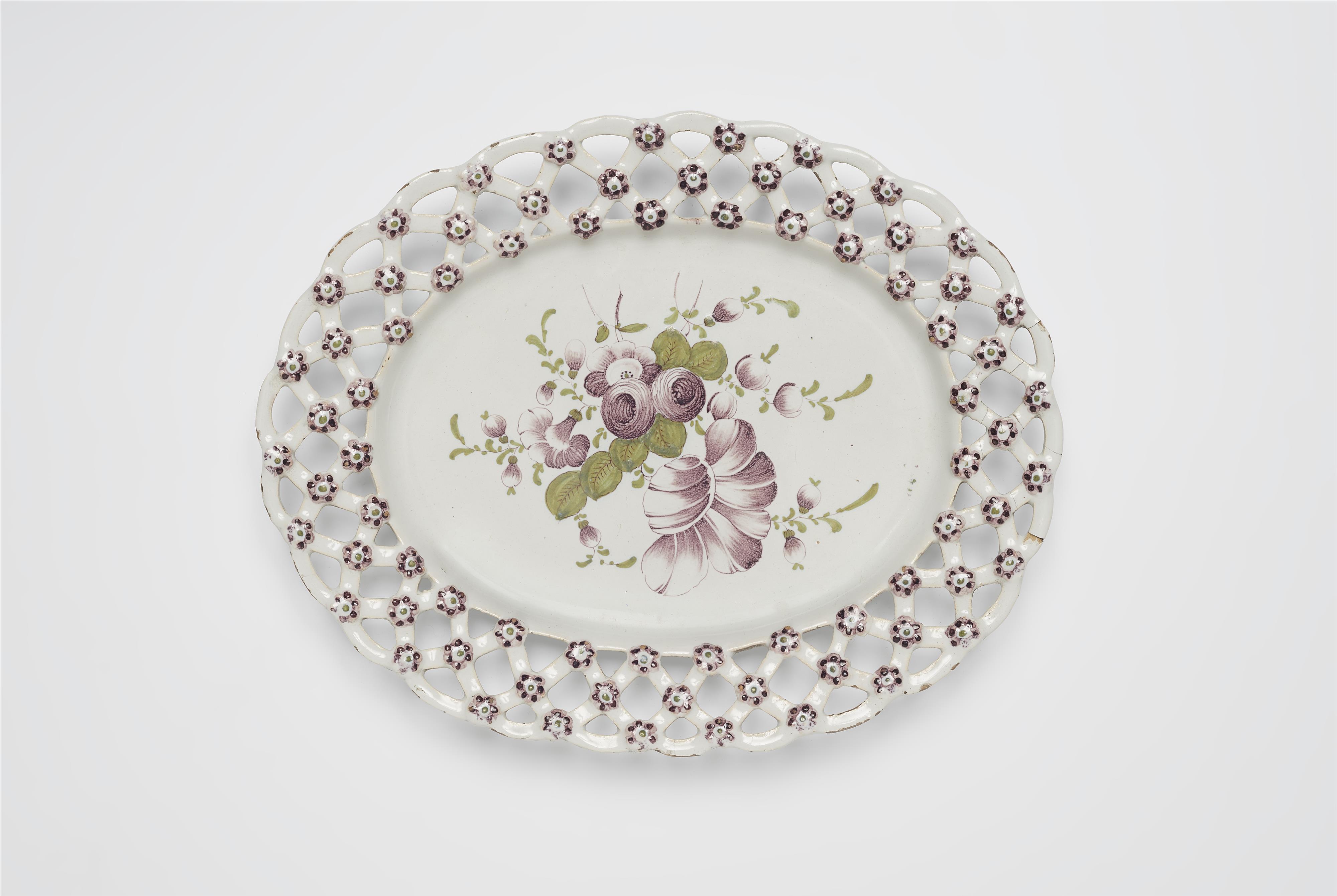 An oval Magdeburg faience platter with pierced rim - image-1