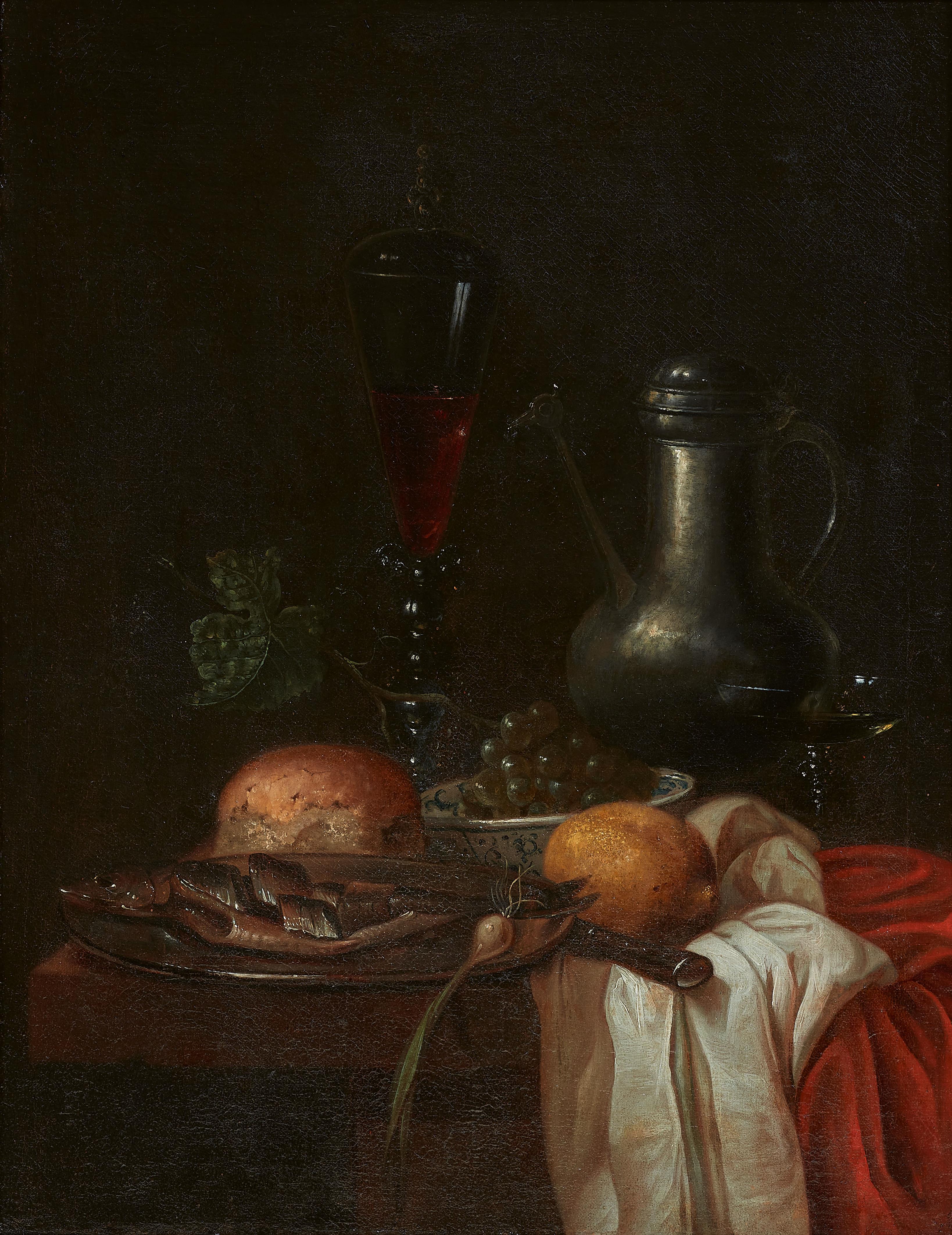 Willem Kalf, follower of - A Herring on a Pewter Plate, a Loaf of Bread, Grapes in a Porcelain Bowl, a Glass Goblet, a Pewter Jug and Other Objects on a Set Table - image-1