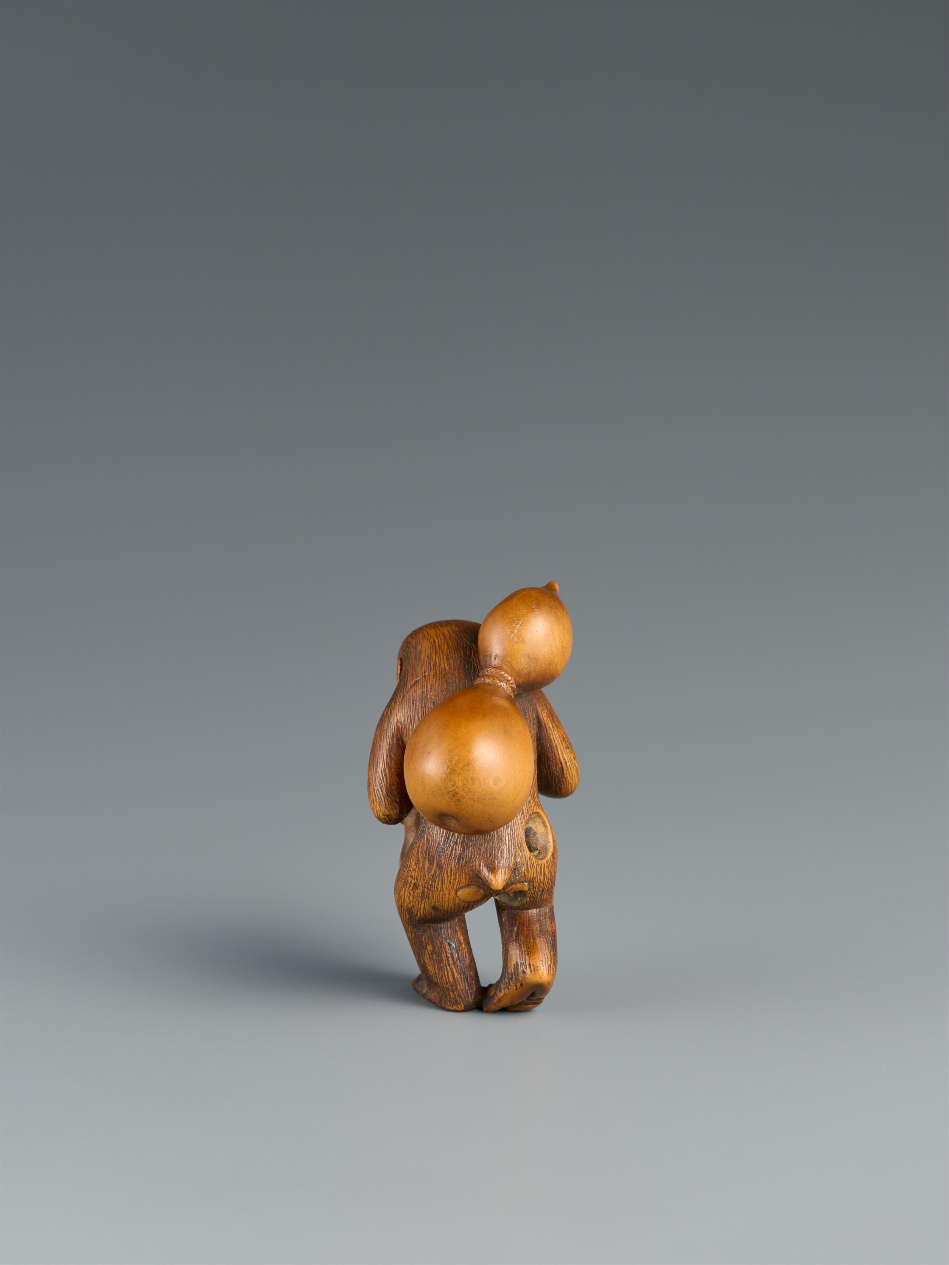 A boxwood netsuke of a monkey with a large gourd. Late 19th century - image-2