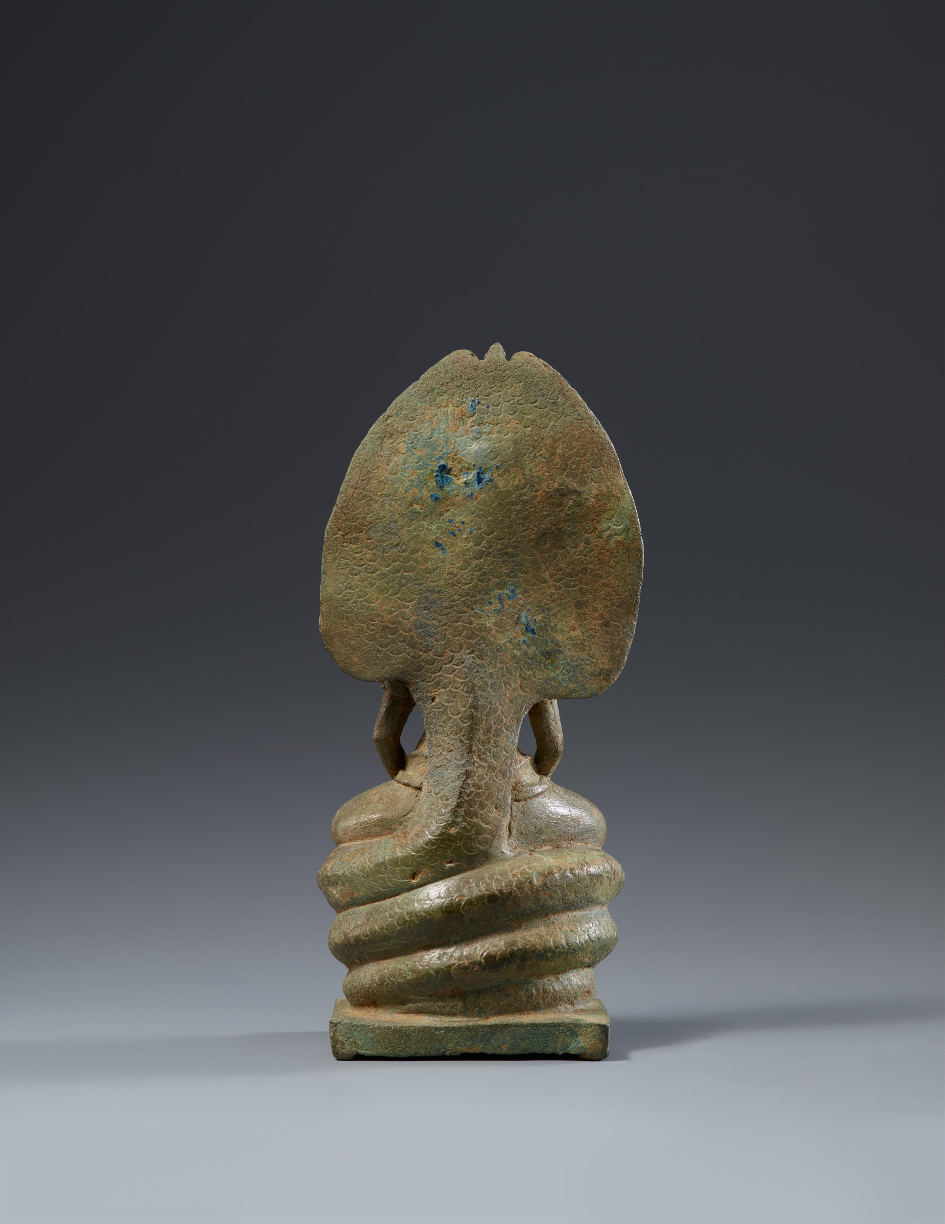An Angkor-style bronze figure of a naga-protected bejeweled Buddha. Cambodia. Angkor period, 12th/13th century - image-2
