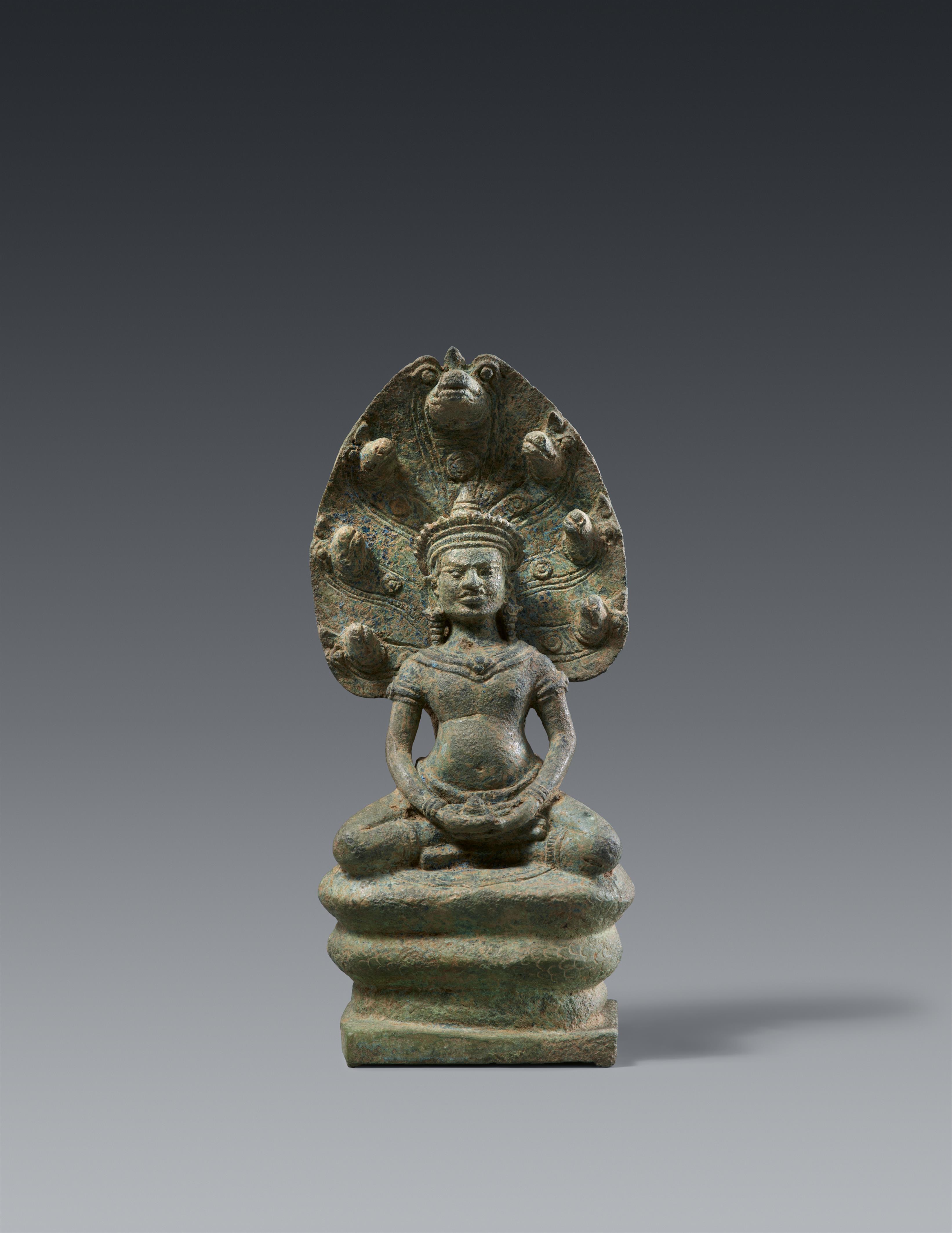 An Angkor-style bronze figure of a naga-protected bejeweled Buddha. Cambodia. Angkor period, 12th/13th century - image-1