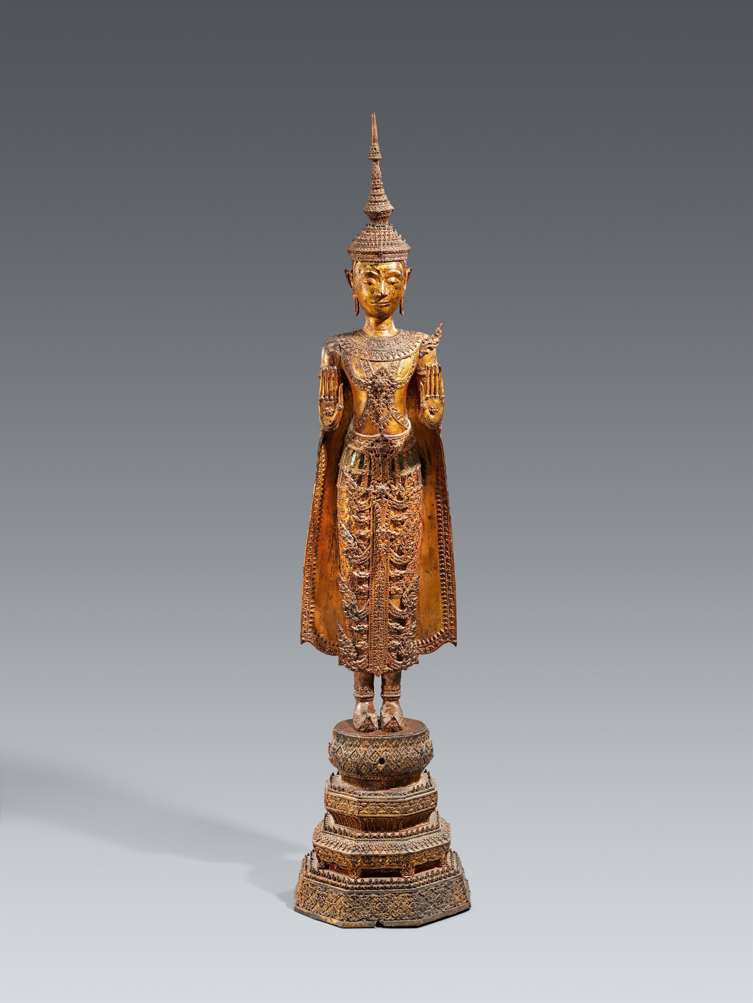 A large and slender Ratanakosin gilded and lacquered bronze figure of a crowned and bejeweled Buddha. Thailand. 19th century - image-1