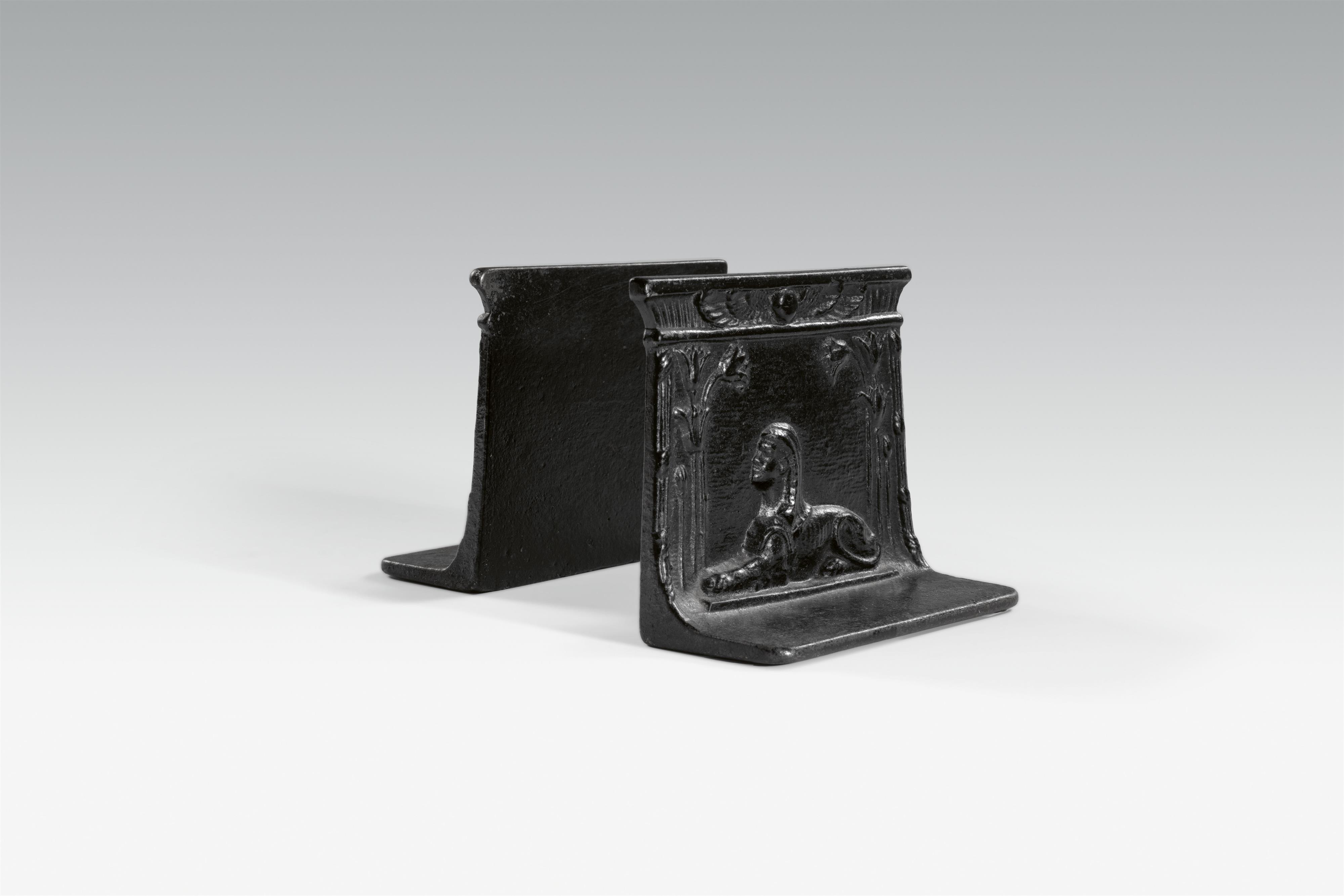 A pair of cast iron sphinx bookends - image-1