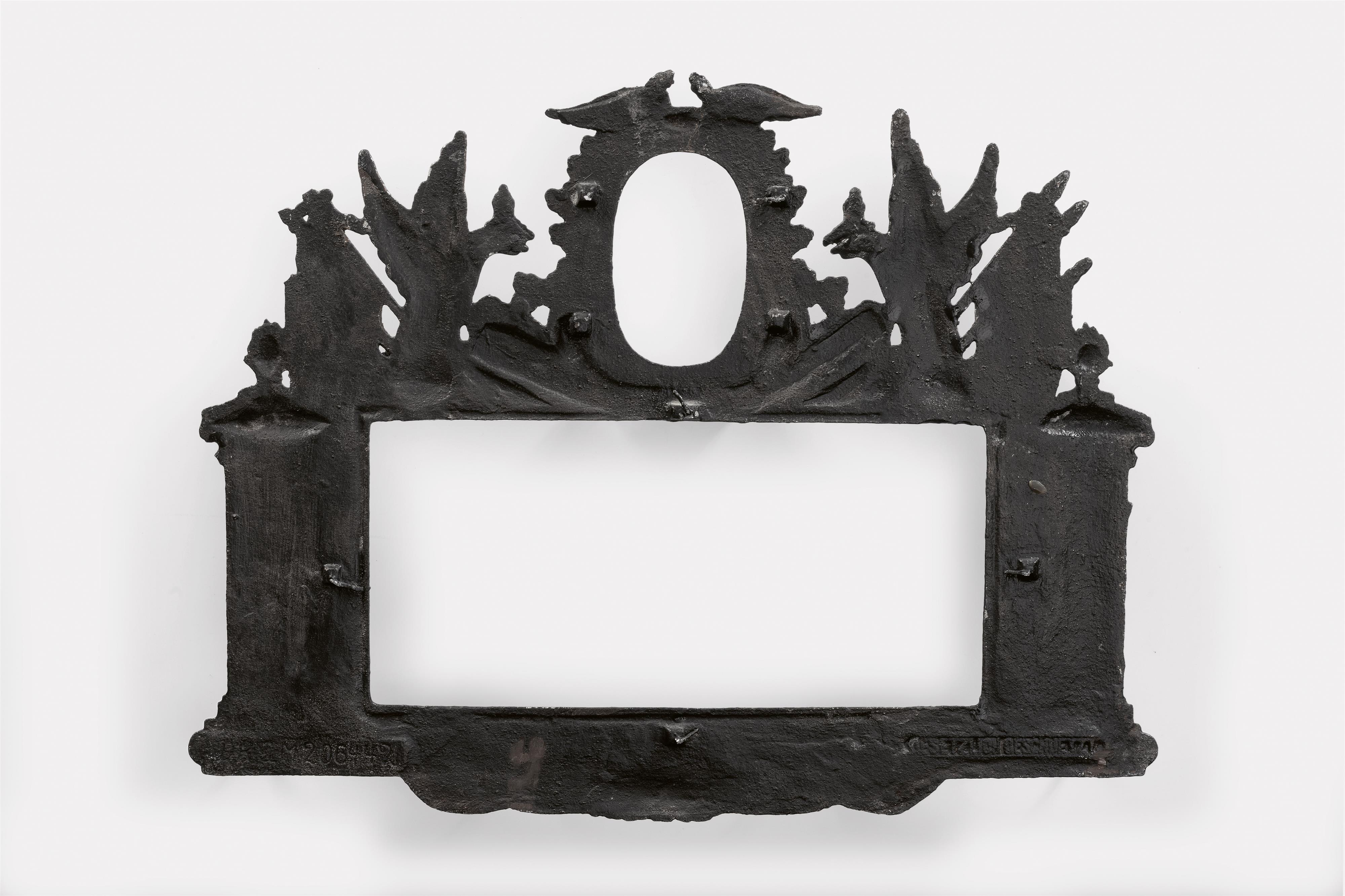 A cast iron frame with a key hook for the 1905 reserve - image-2