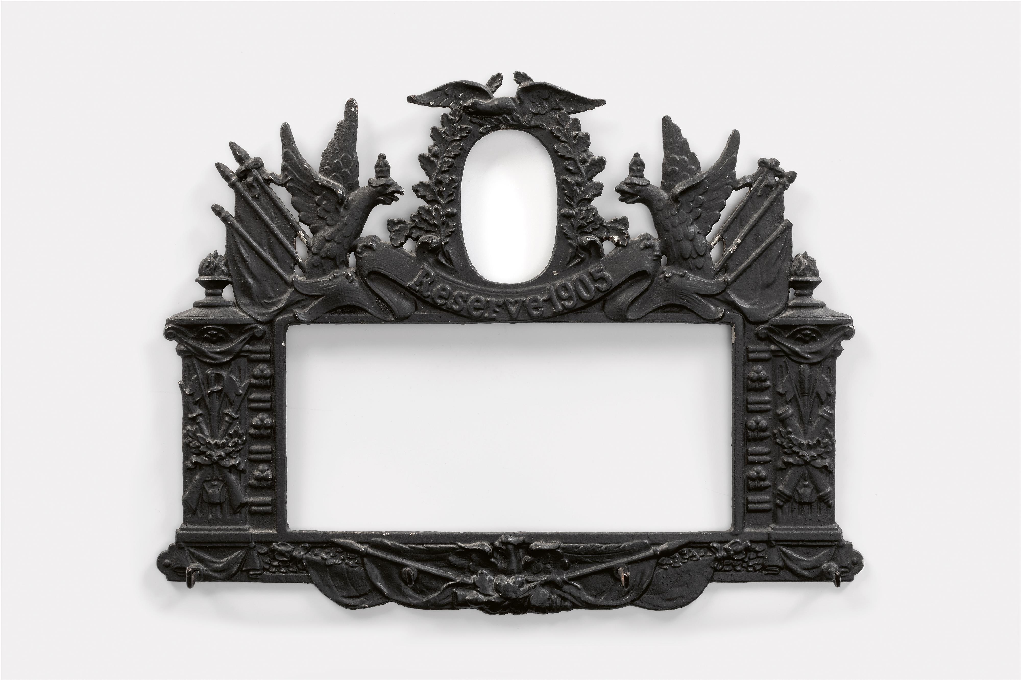 A cast iron frame with a key hook for the 1905 reserve - image-1