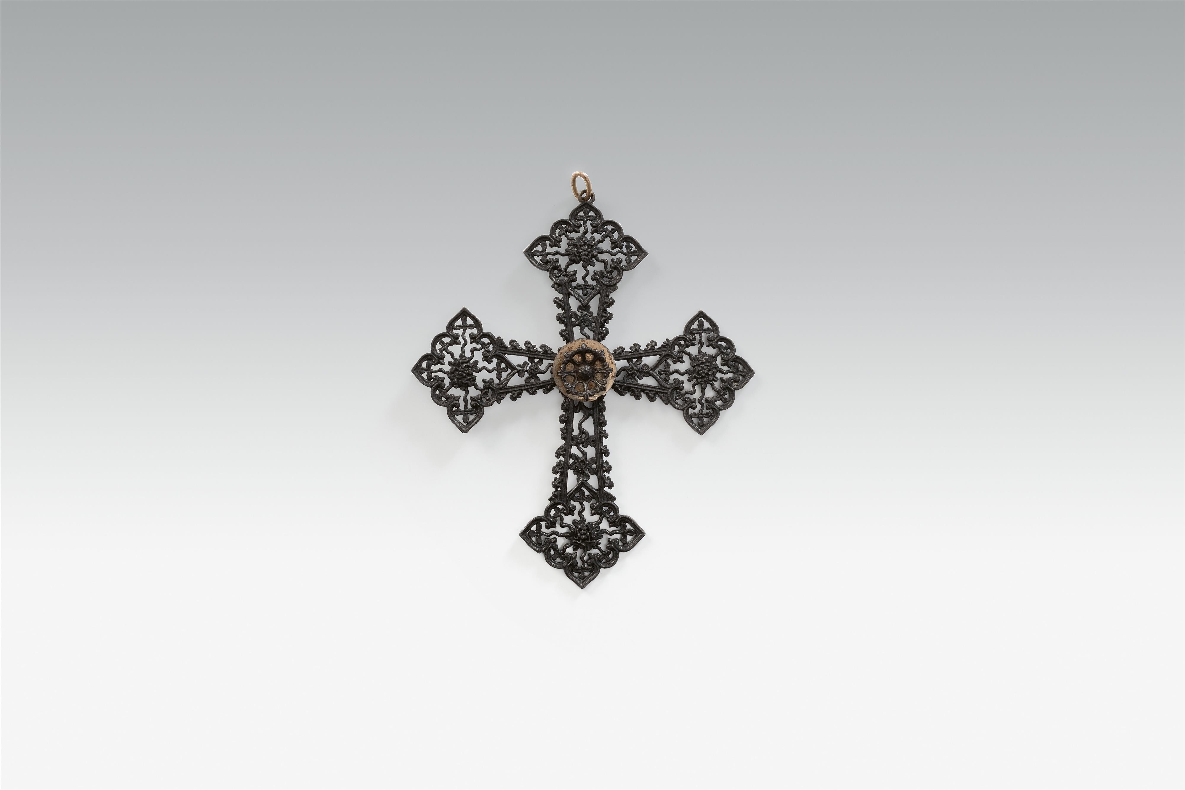 A cast iron and polished steel cross pendant - image-1