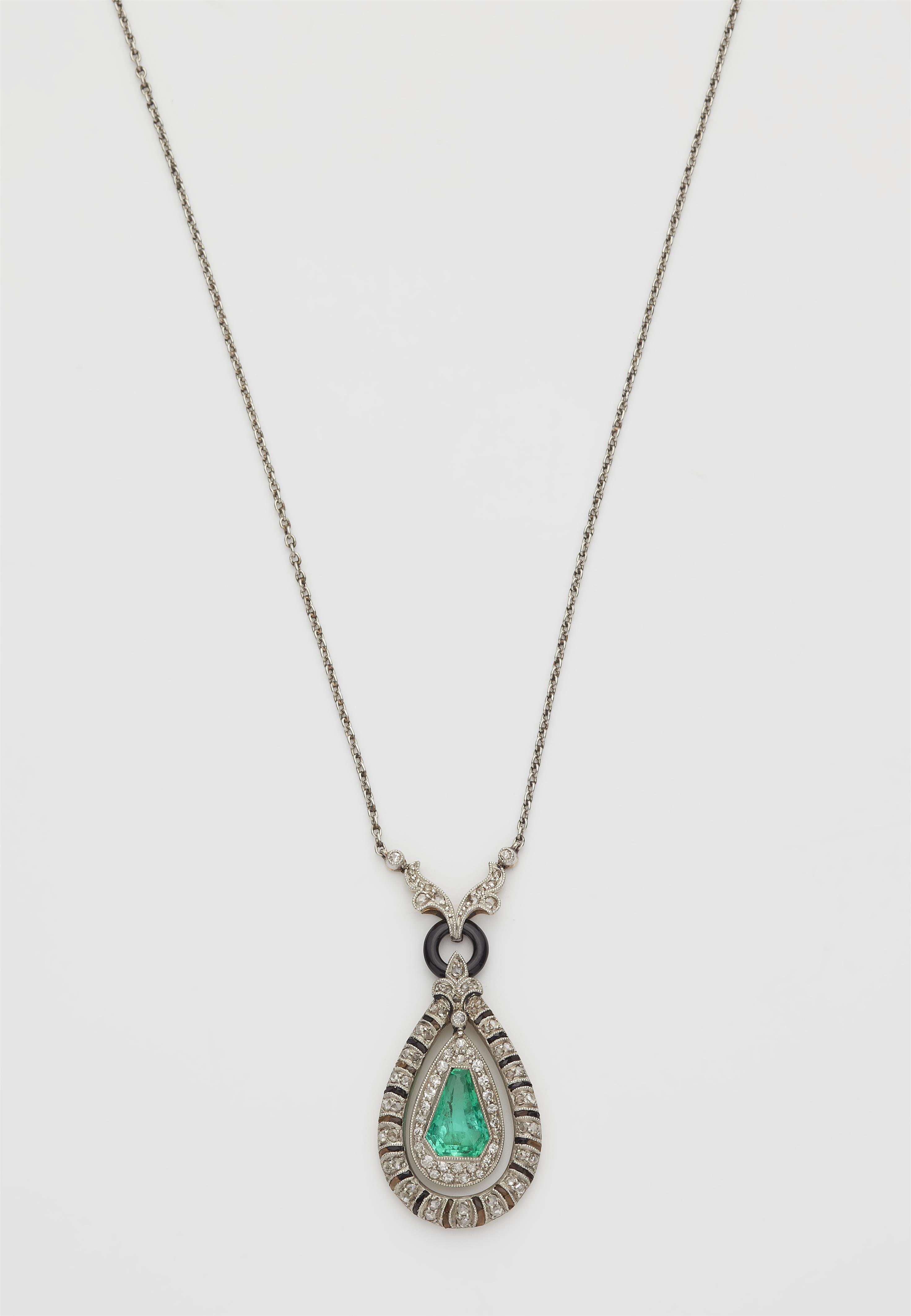 A platinum and 14k gold black enamel diamond onyx and emerald Art Déco pendant necklace. - image-1