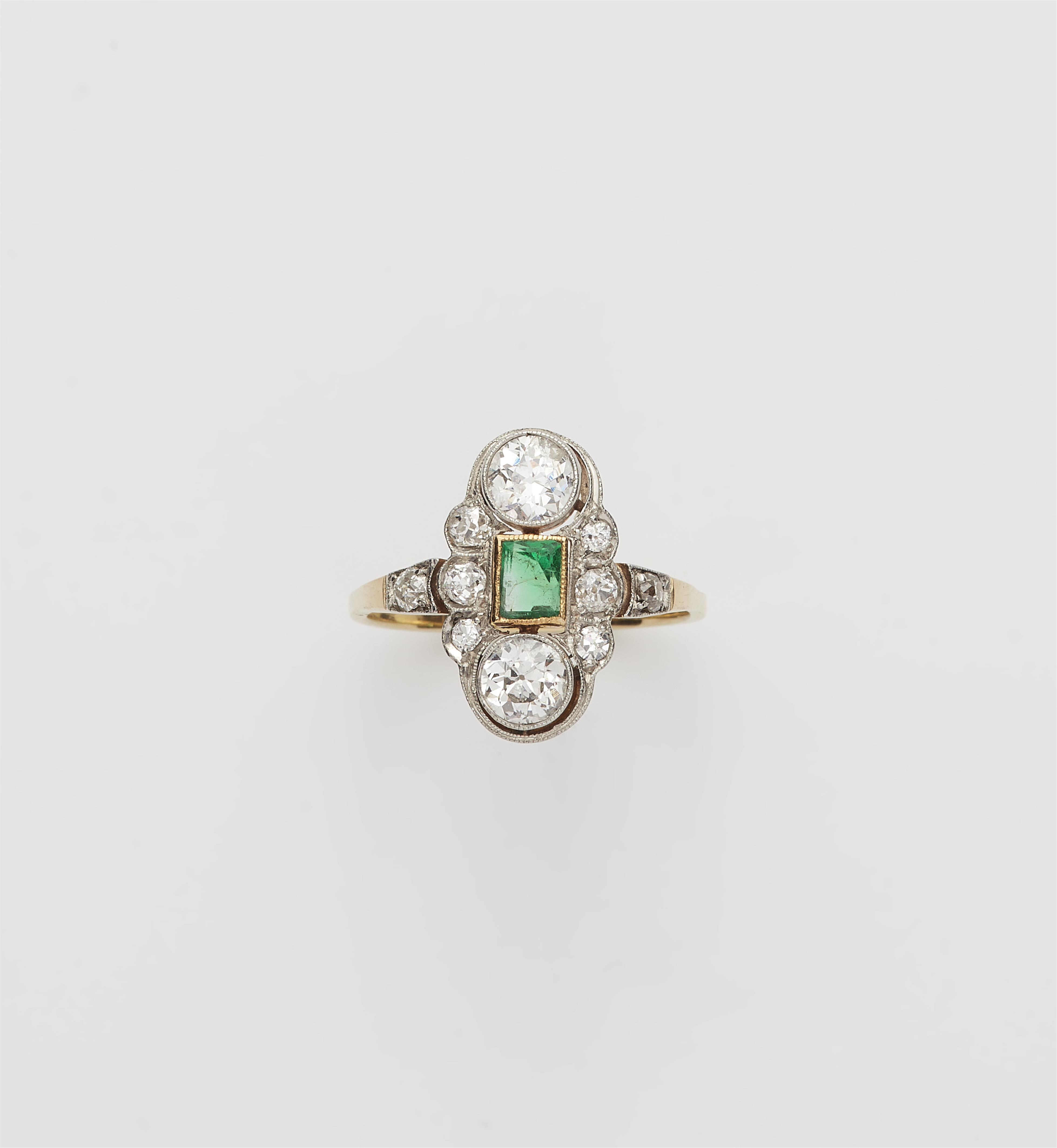 An Art Déco 14 kt gold platinum diamond and emerald ring. - image-1