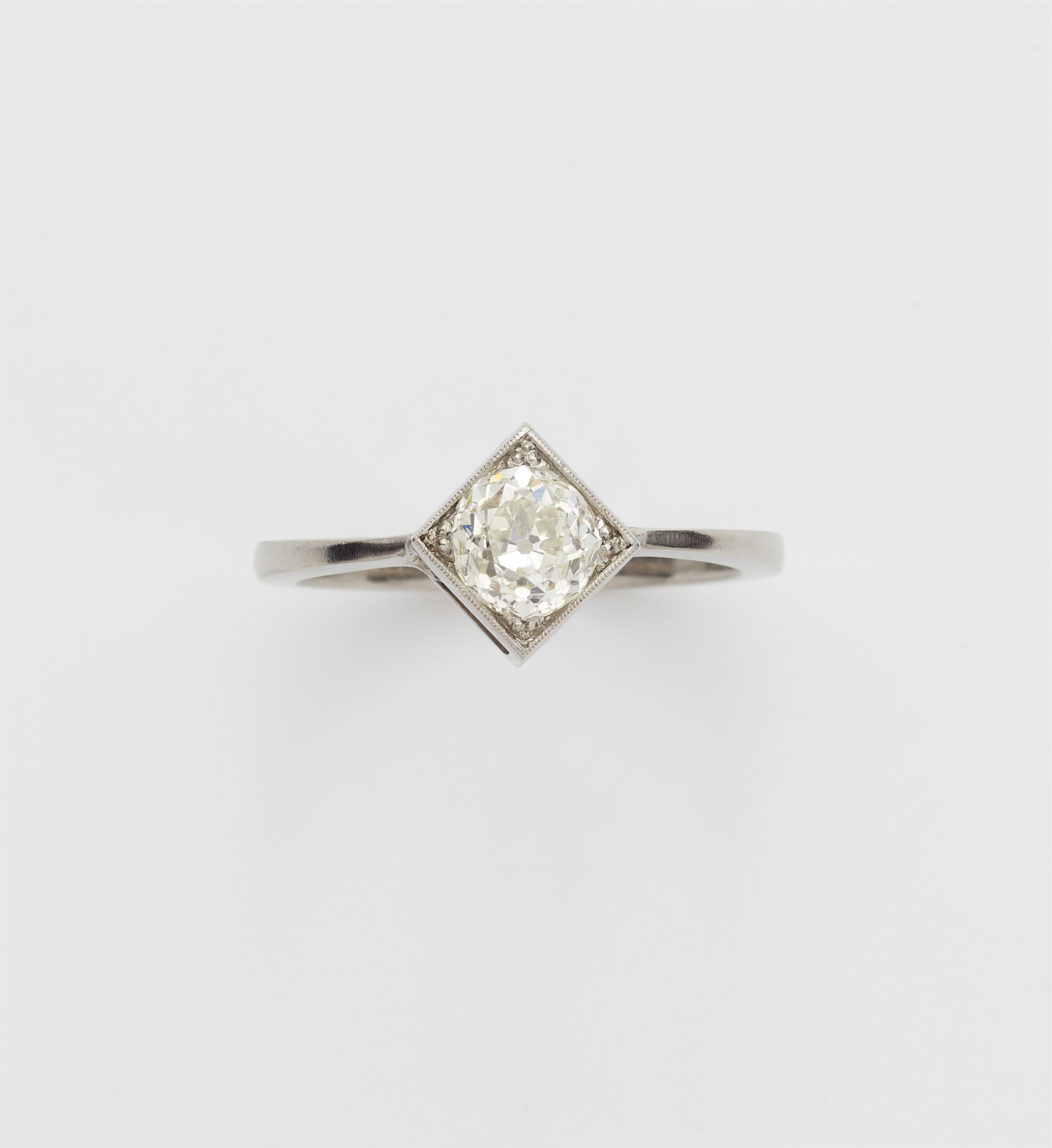 A platinum and European old-cut diamond solitaire ring. - image-1