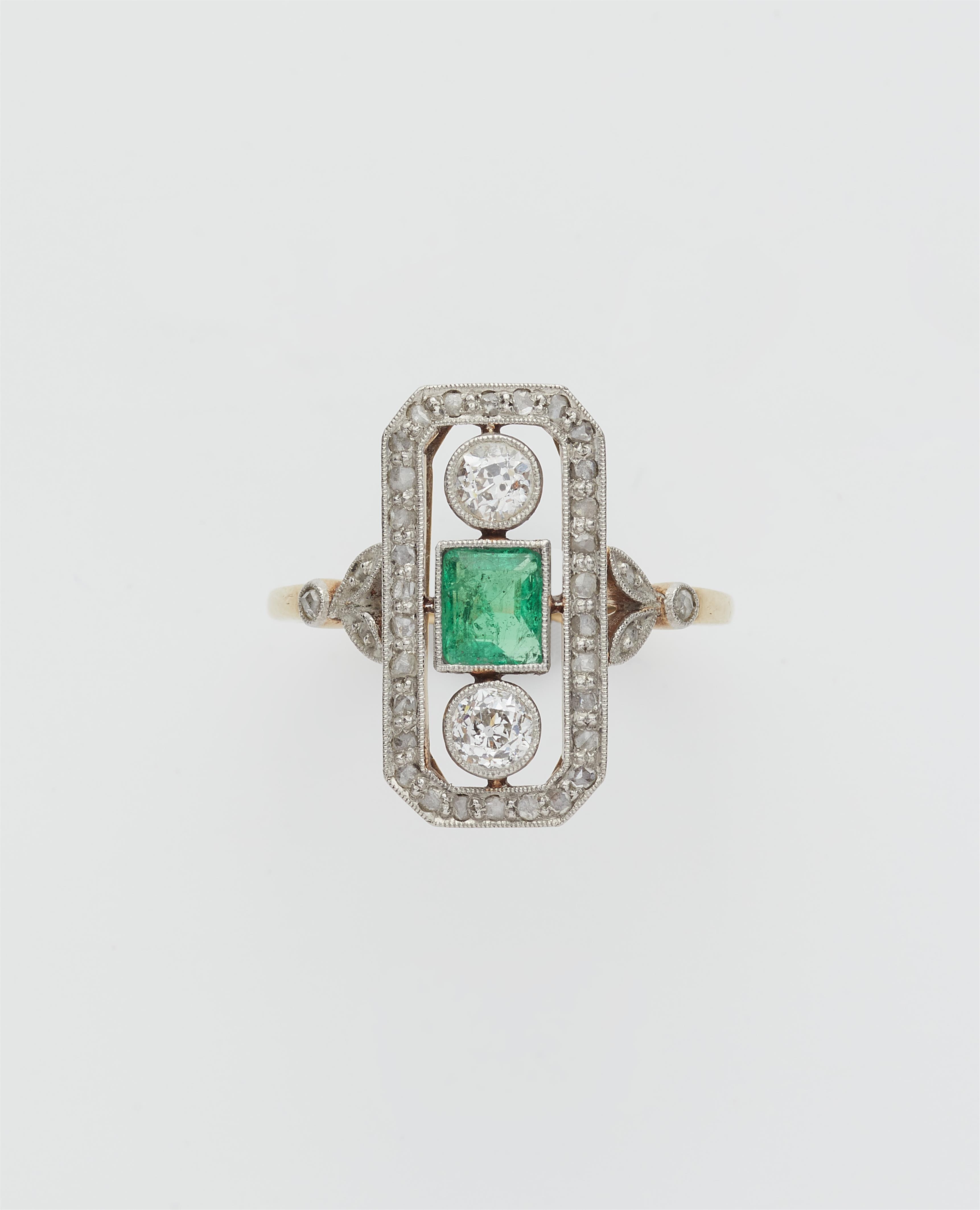 An Art Déco 14k gold platinum diamond and emerald ring. - image-1