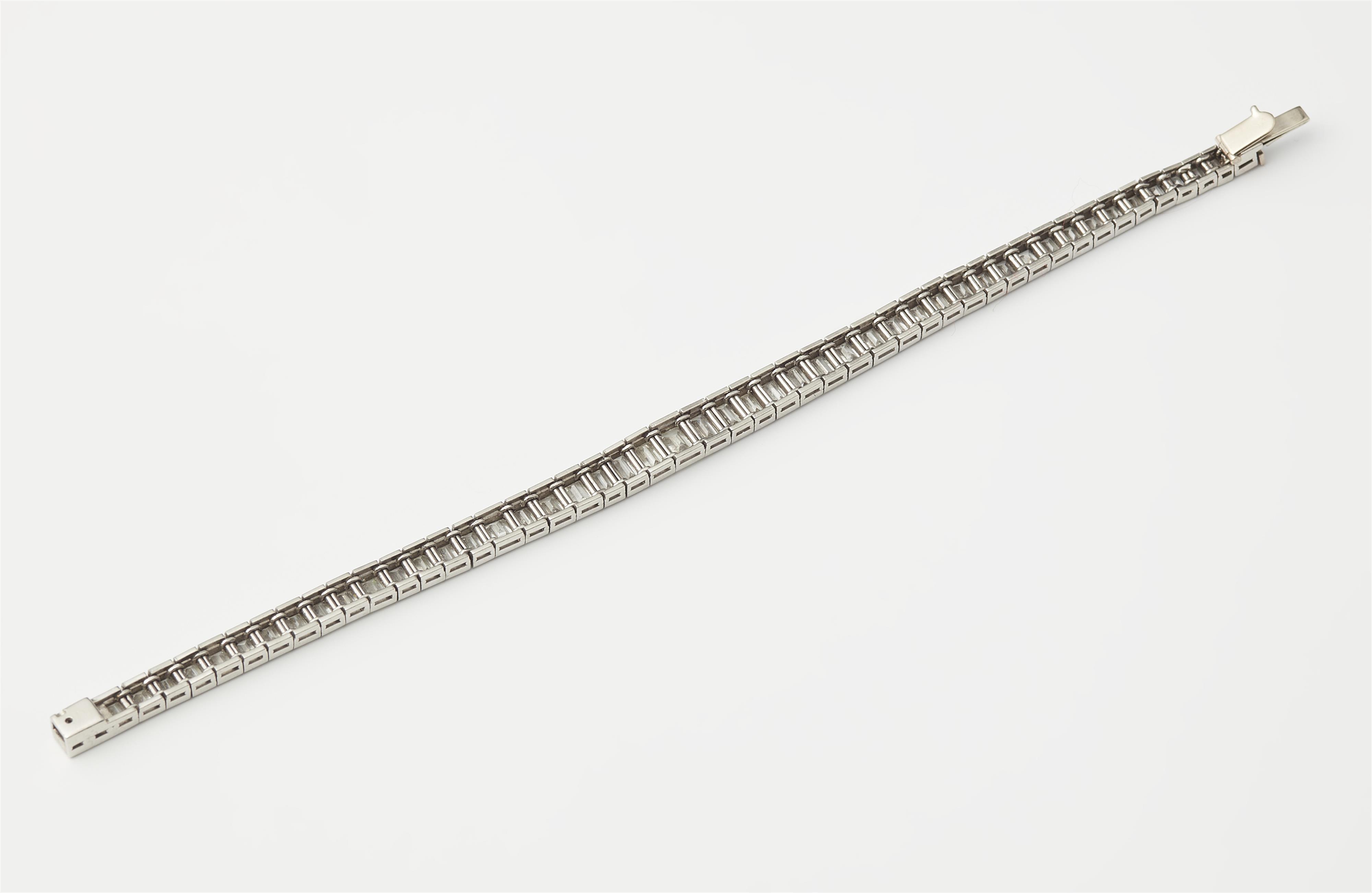 An Art Déco platinum and baguette-cut diamond tennis bracelet, ca. 1925. - image-2