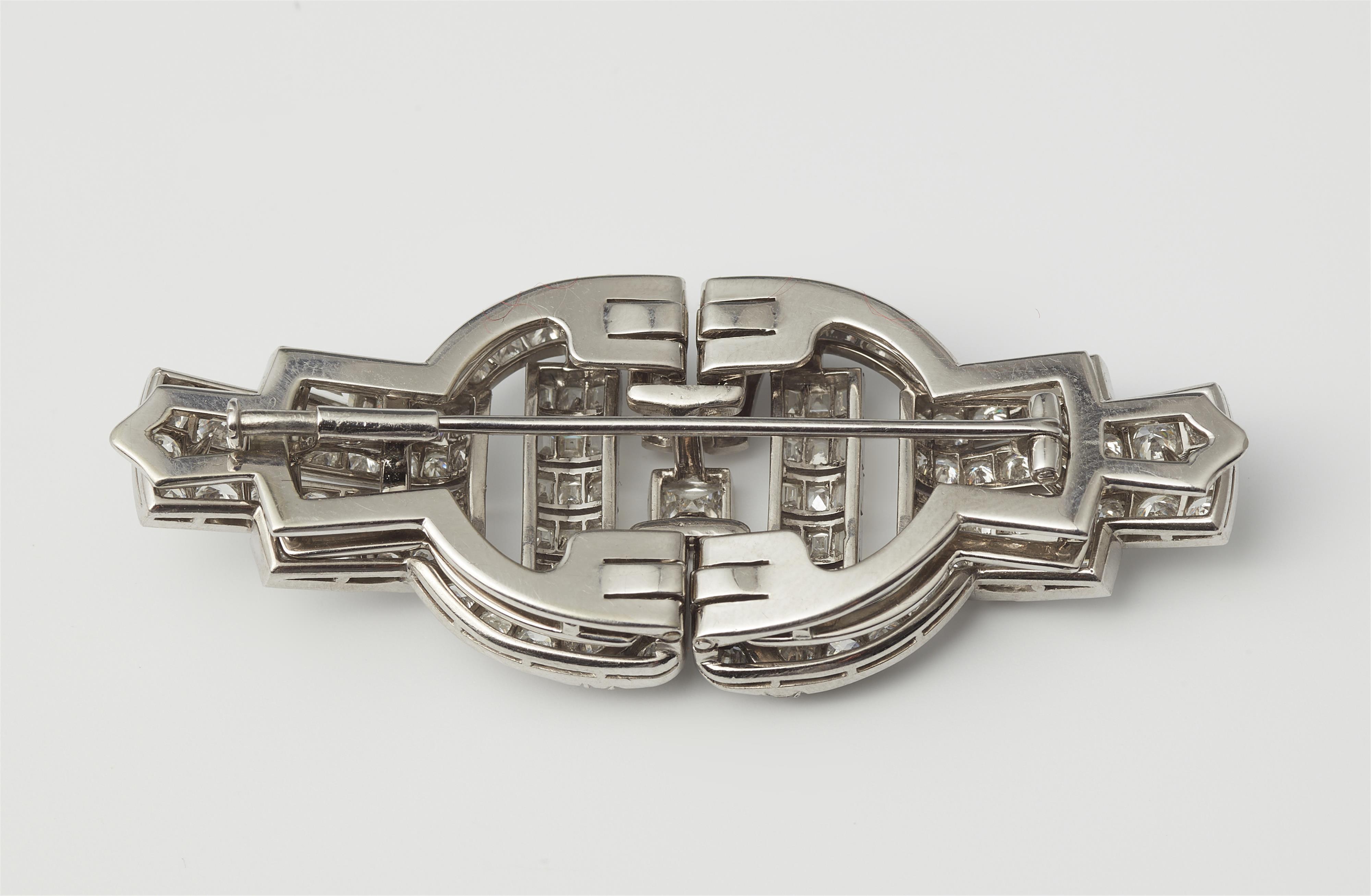 An Art Déco 18k white gold and diamond double clip brooch. - image-2