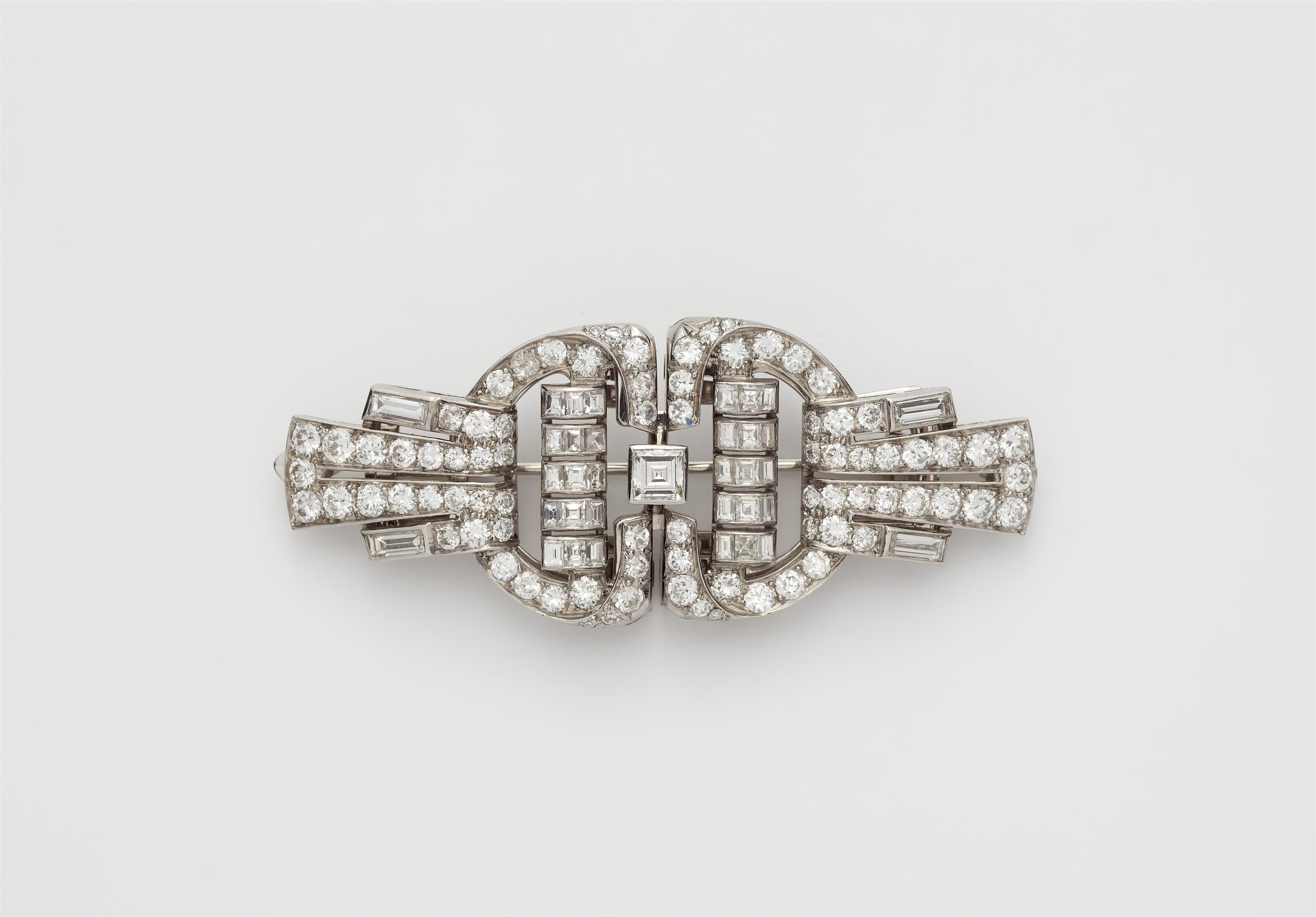 An Art Déco 18k white gold and diamond double clip brooch. - image-1