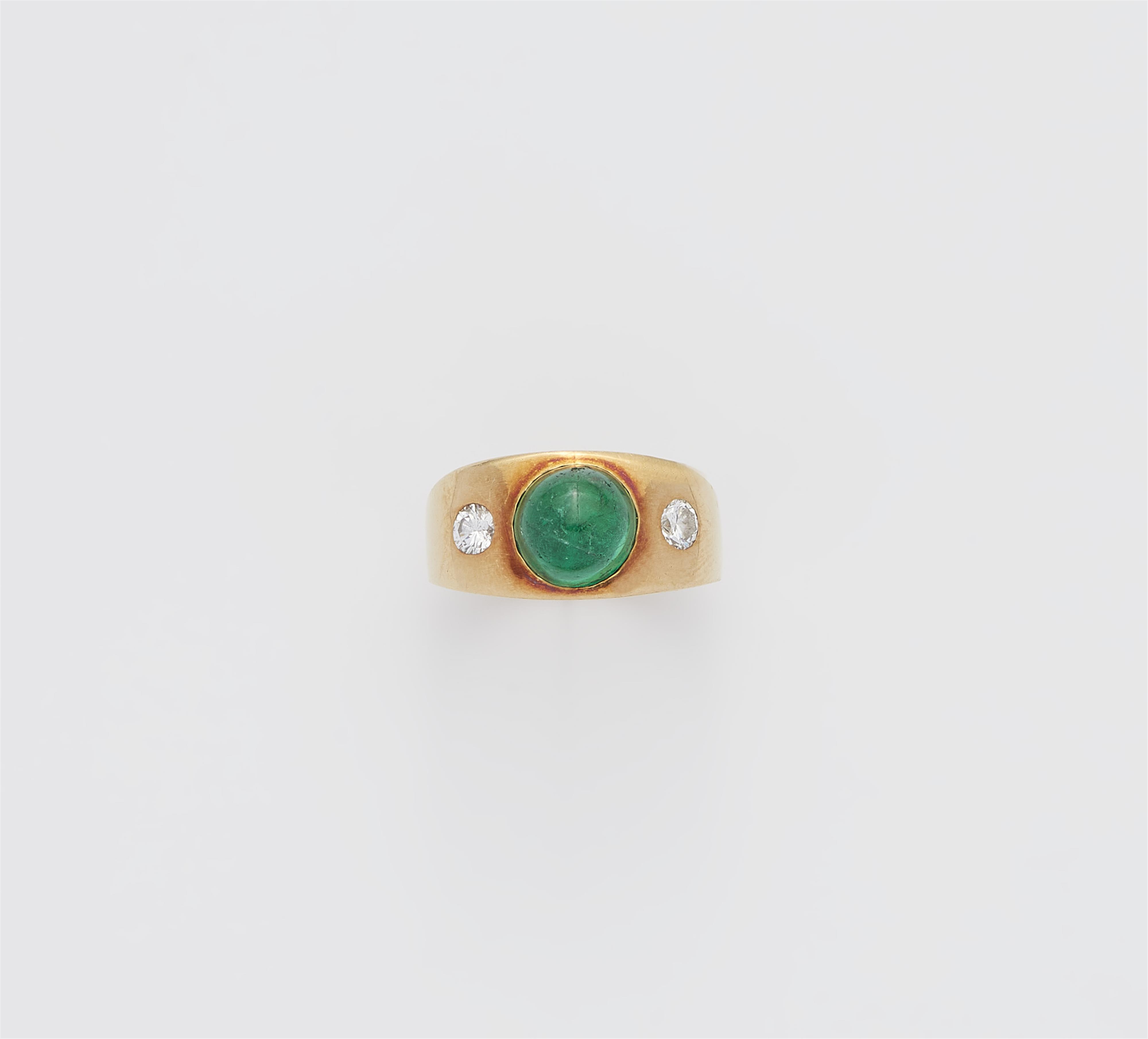 An 18k gold diamond and sugarloaf-cut emerald three stone ring. - image-1