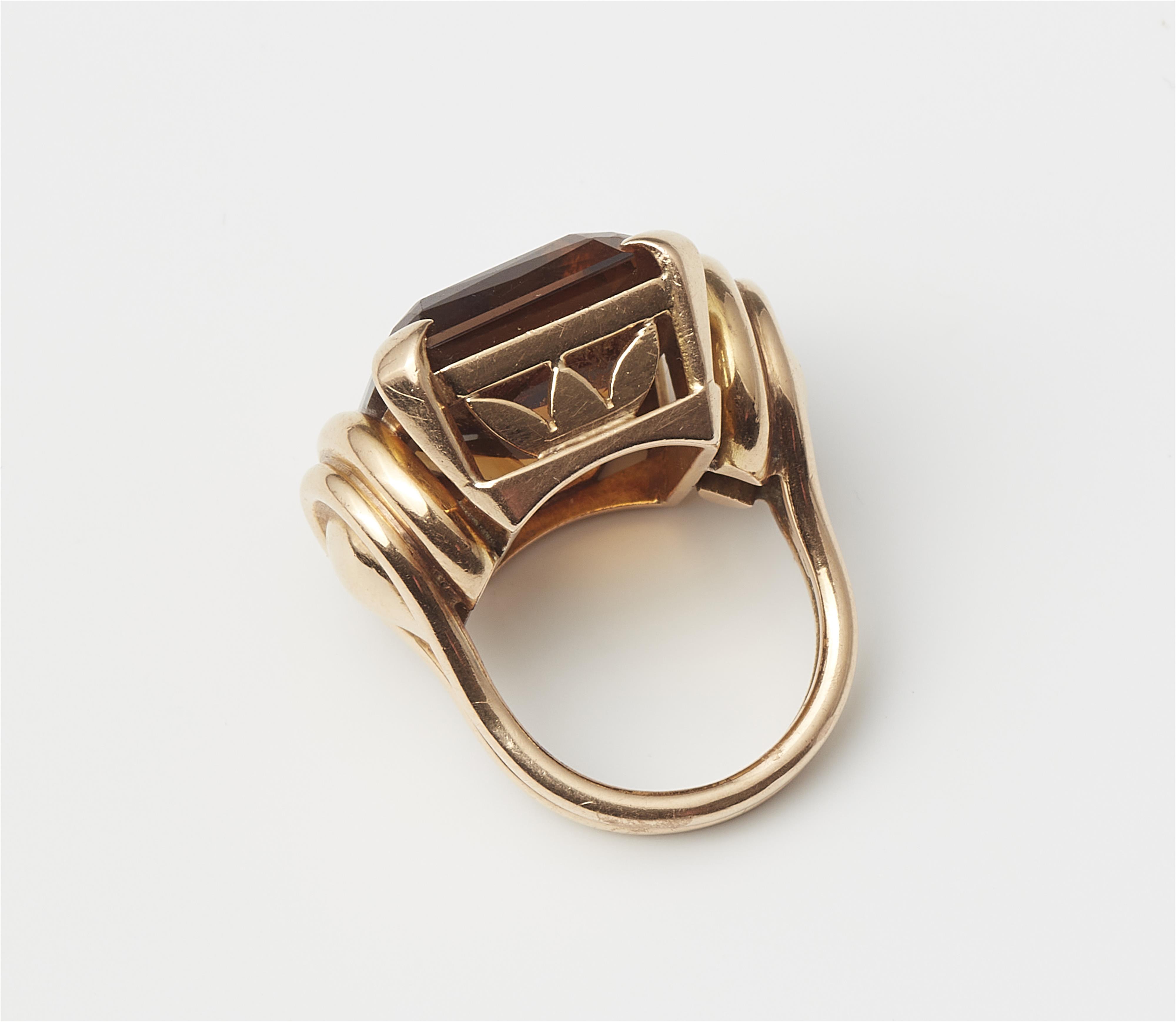 A Retro Style 18k rose gold and large cognac coloured citrine ring. - image-3