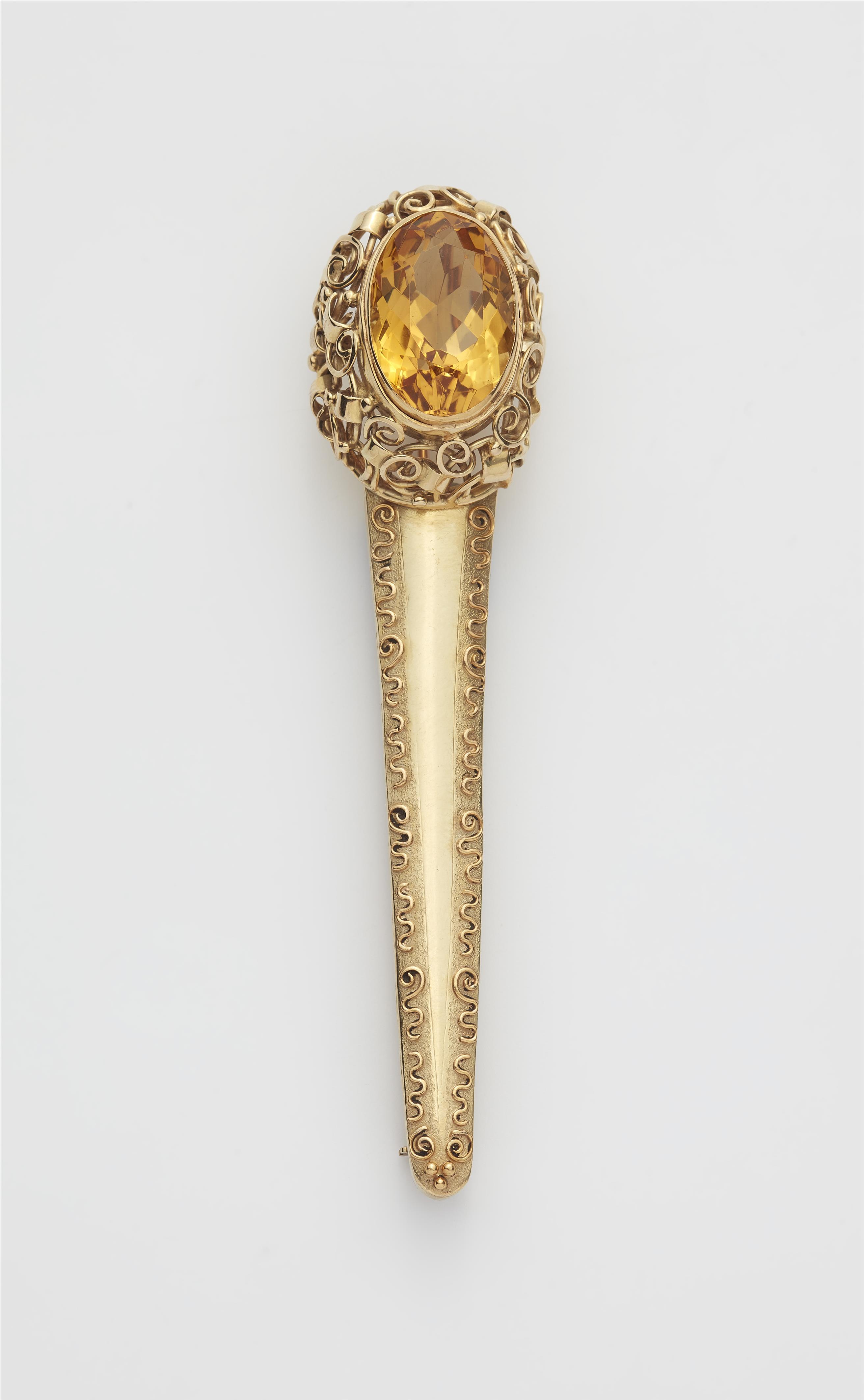 A German 14k gold and citrine pin brooch. - image-1