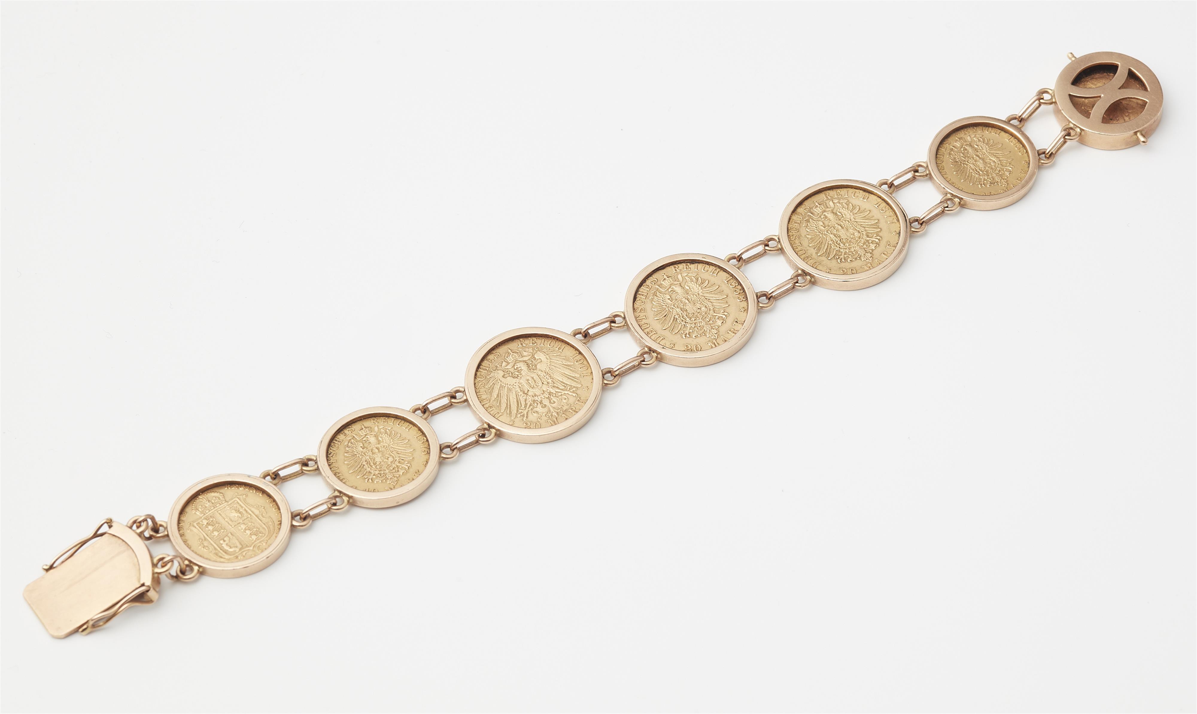 A German 14k rose gold bracelet with seven gold coins. - image-2