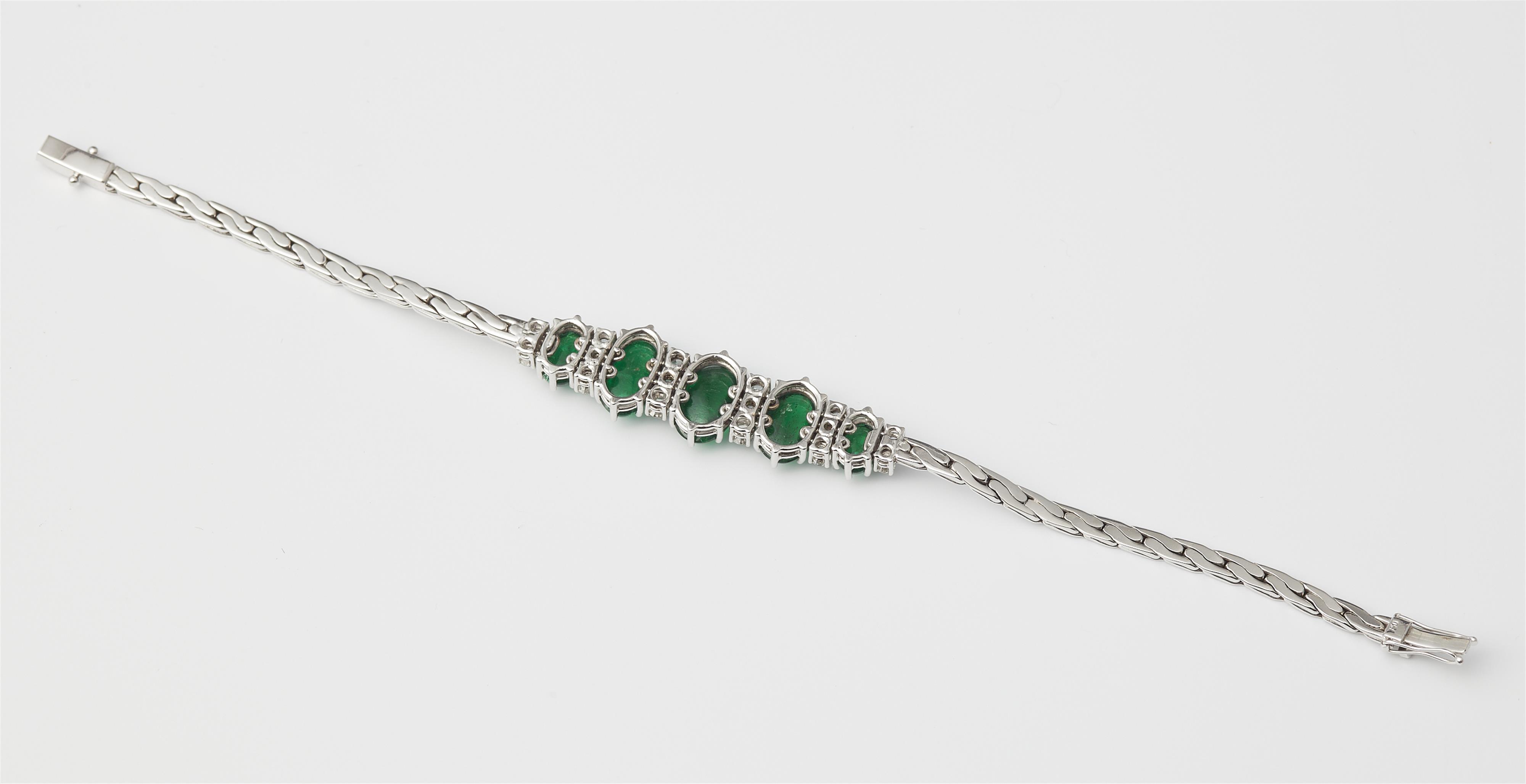 An 18k white gold diamond and emerald cabochon bracelet. - image-2