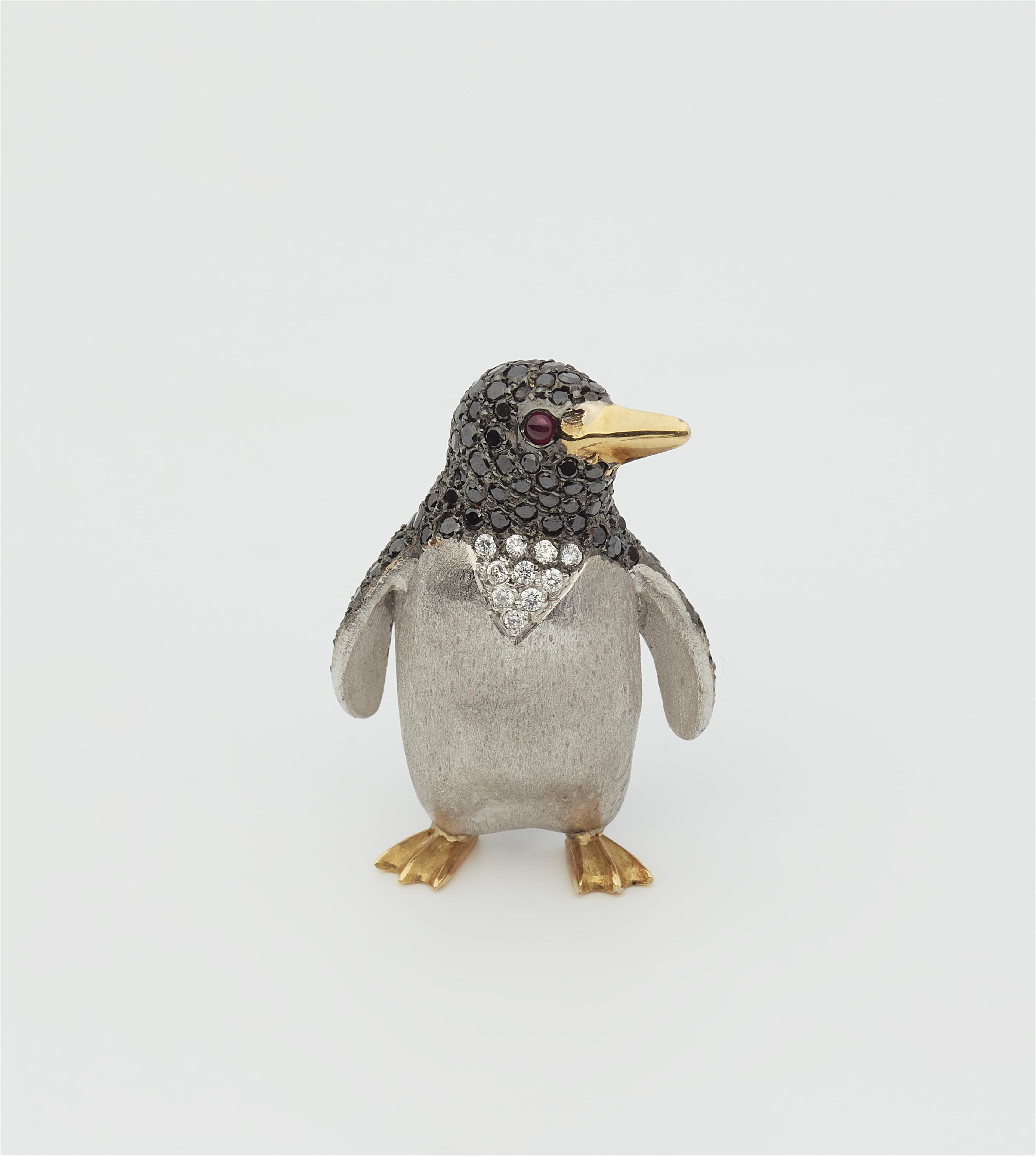 A small German 18k bicolour gold, black and white diamond pinguin brooch. - image-1