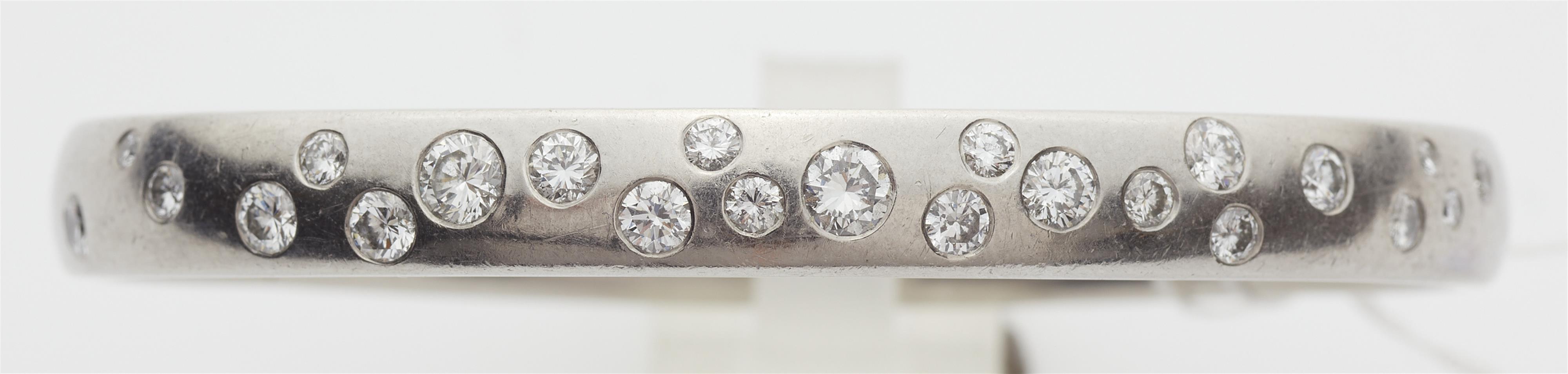 A German platinum and brilliant-cut diamond bangle. - image-2