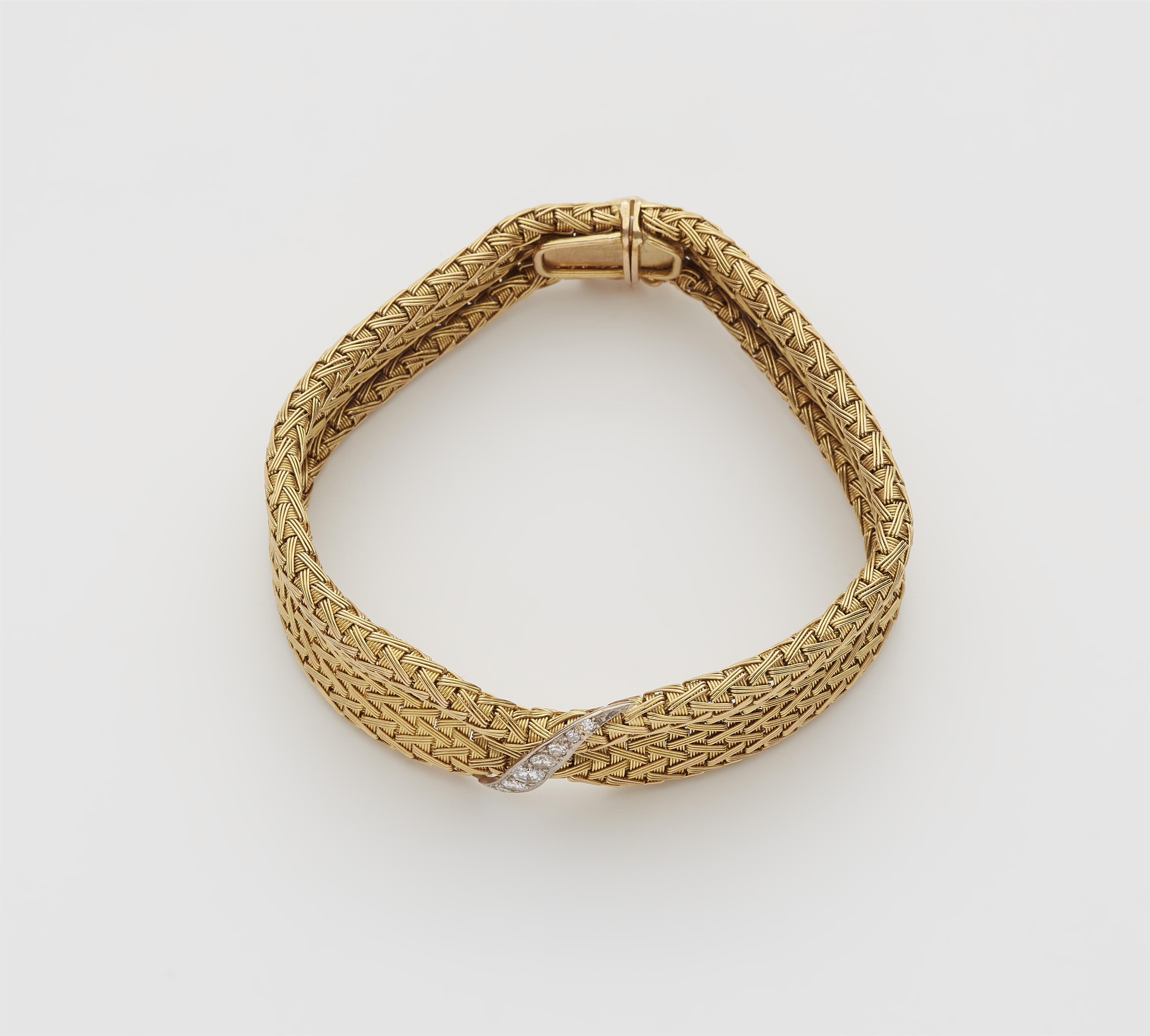 A flexible 18k gold meshwork bracelet with diamond strip. - image-1