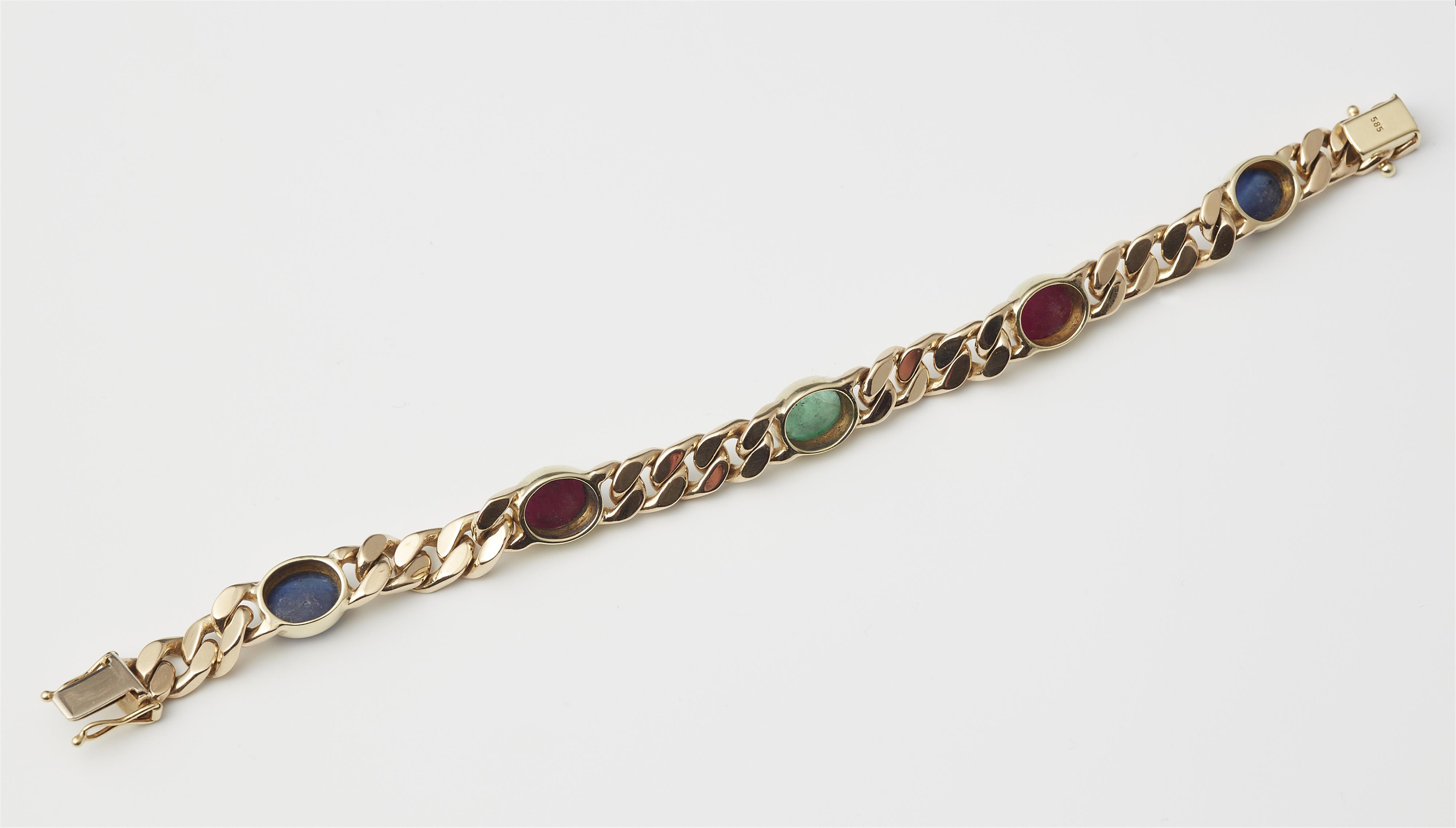 A 14k gold ruby, sapphire and emerald curb chain bracelet. - image-2