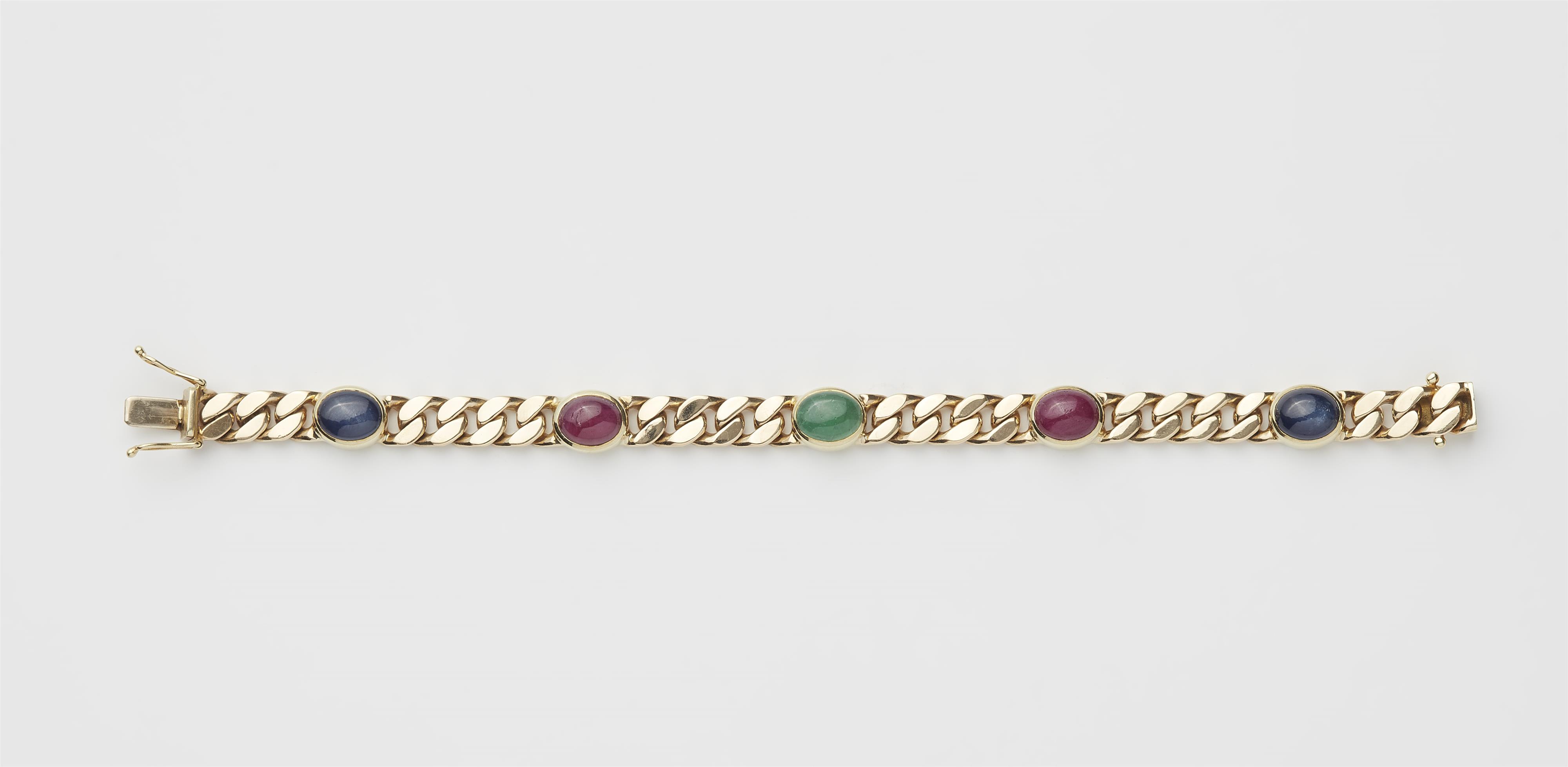 A 14k gold ruby, sapphire and emerald curb chain bracelet. - image-1