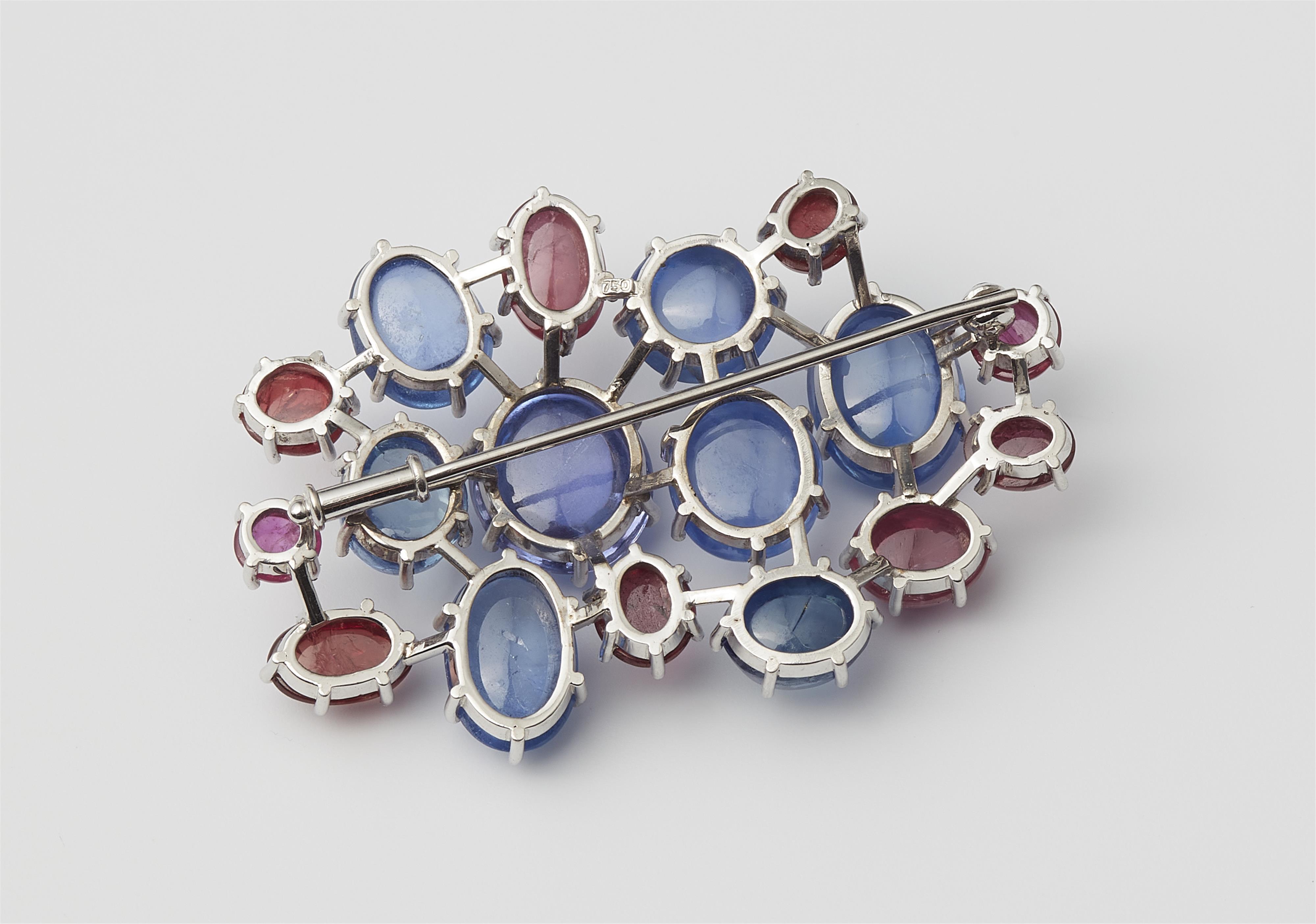 A German 18k white gold Ceylon sapphire and ruby cabochon brooch. - image-3