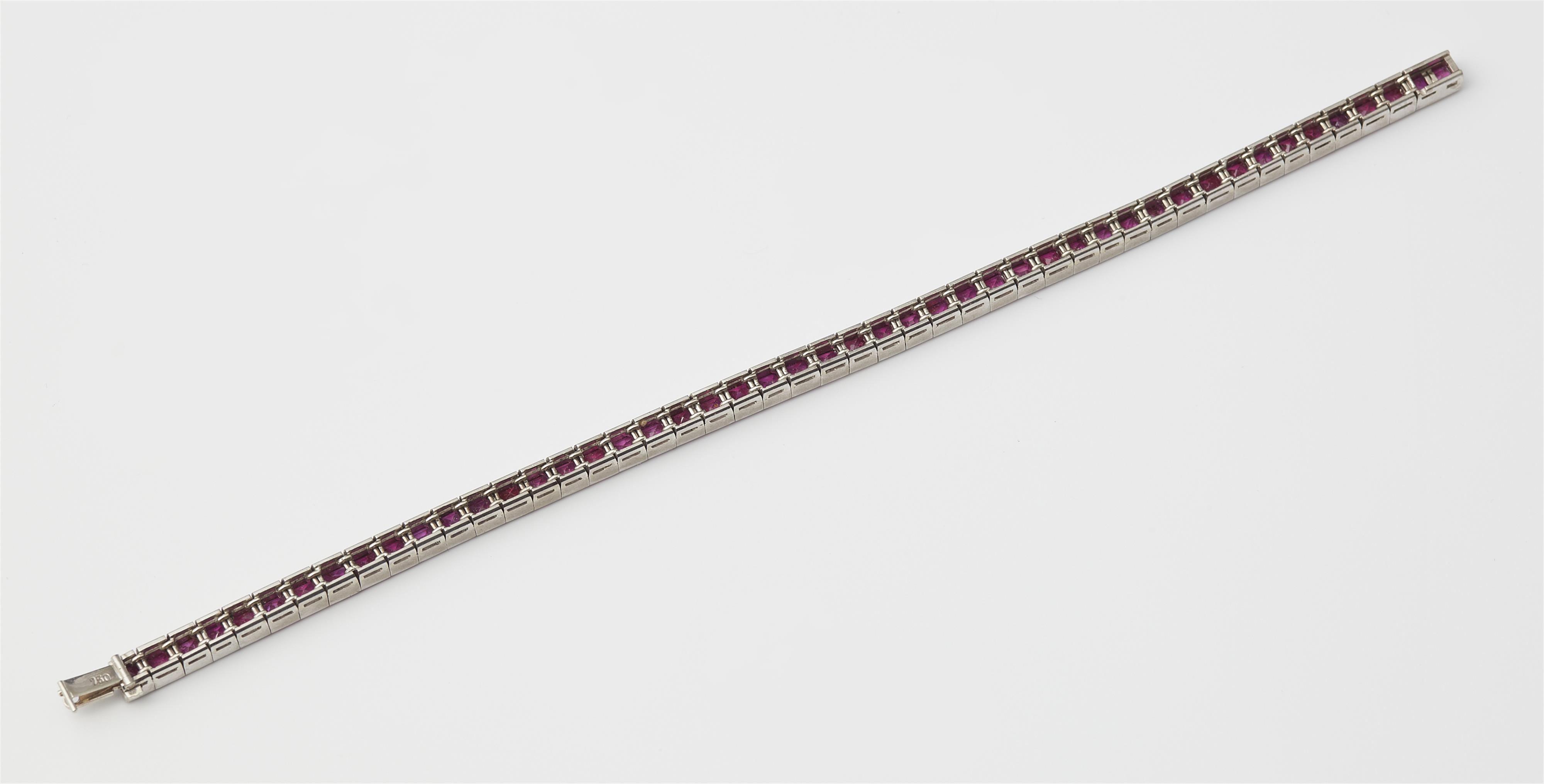 A 14k gold and carré-cut ruby tennis bracelet. - image-2