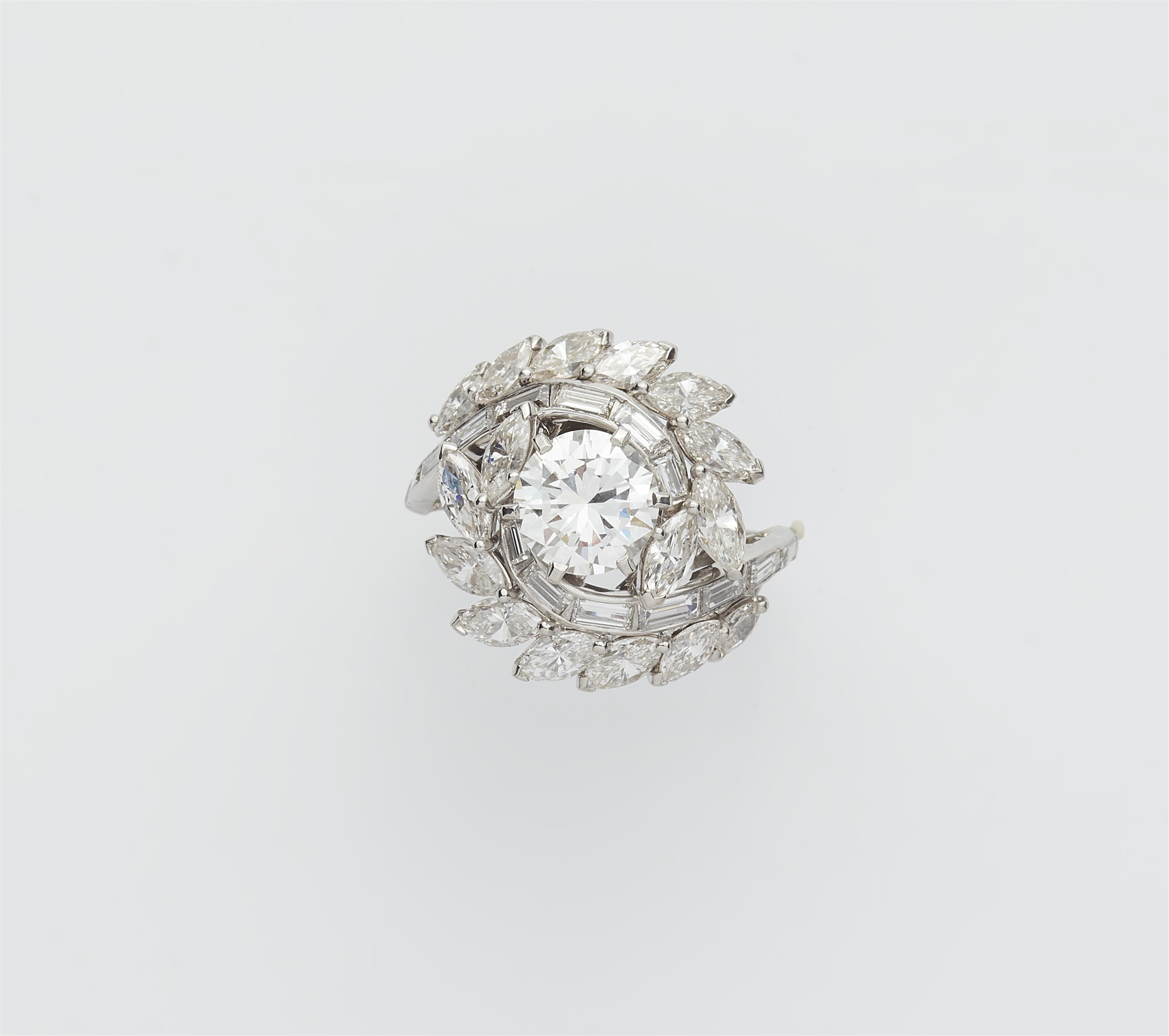 A platinum diamond swirl ring with a ca. 1.50 ct brilliant-cut diamond solitaire. - image-1