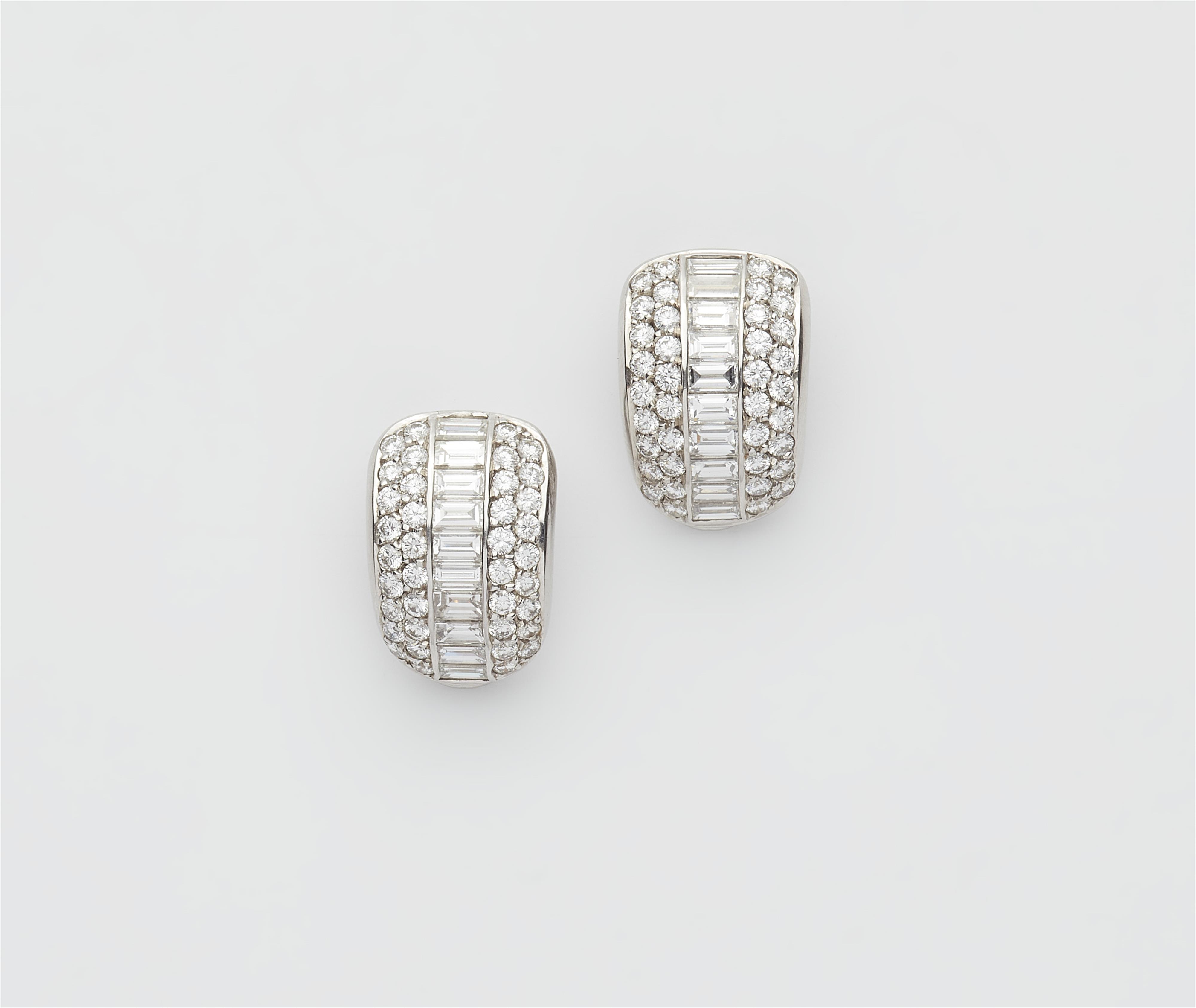 A pair of 18k white gold and diamond clip earrings. - image-1