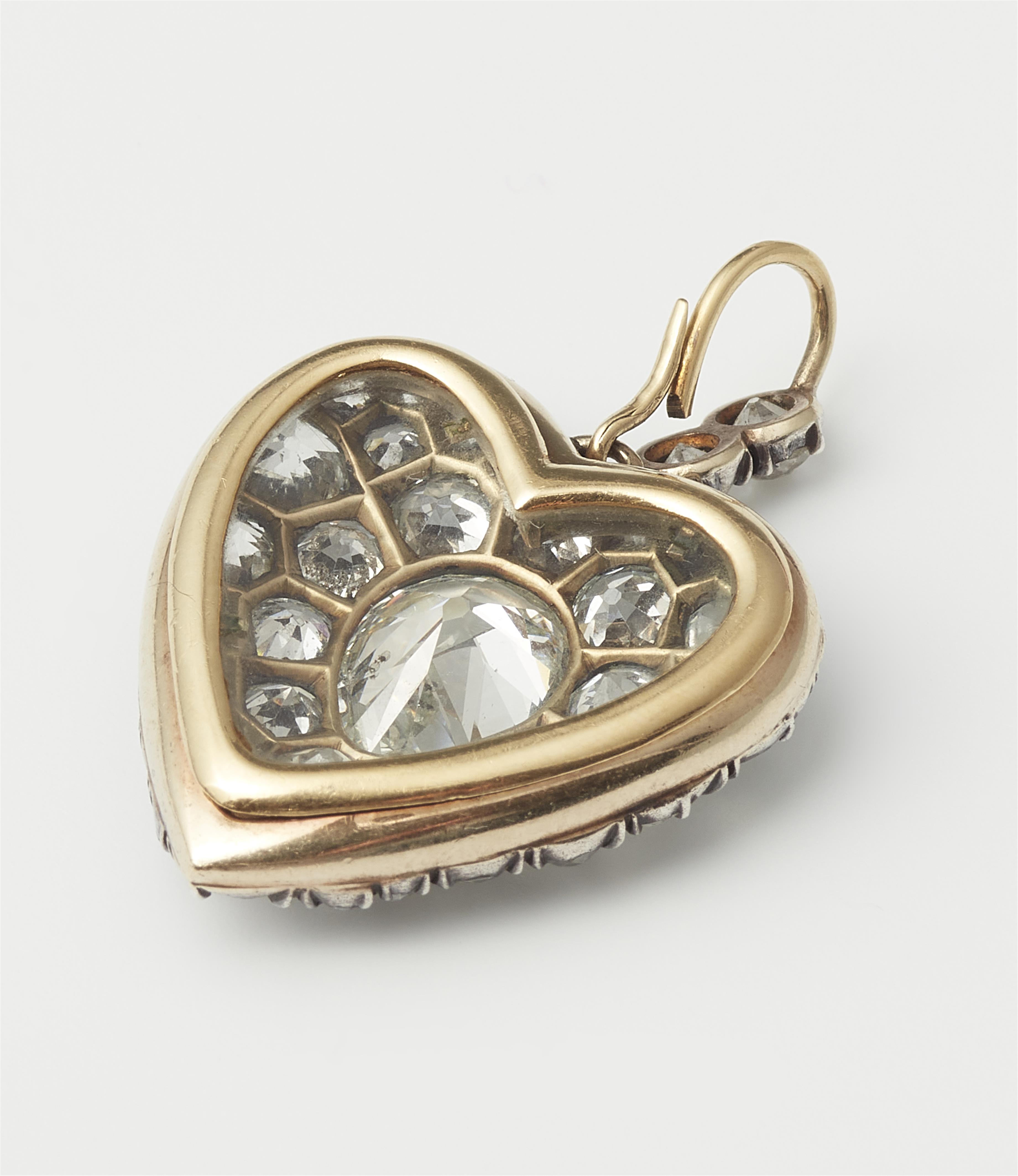 A Victorian silver 18k gold and diamond heart locket. - image-2