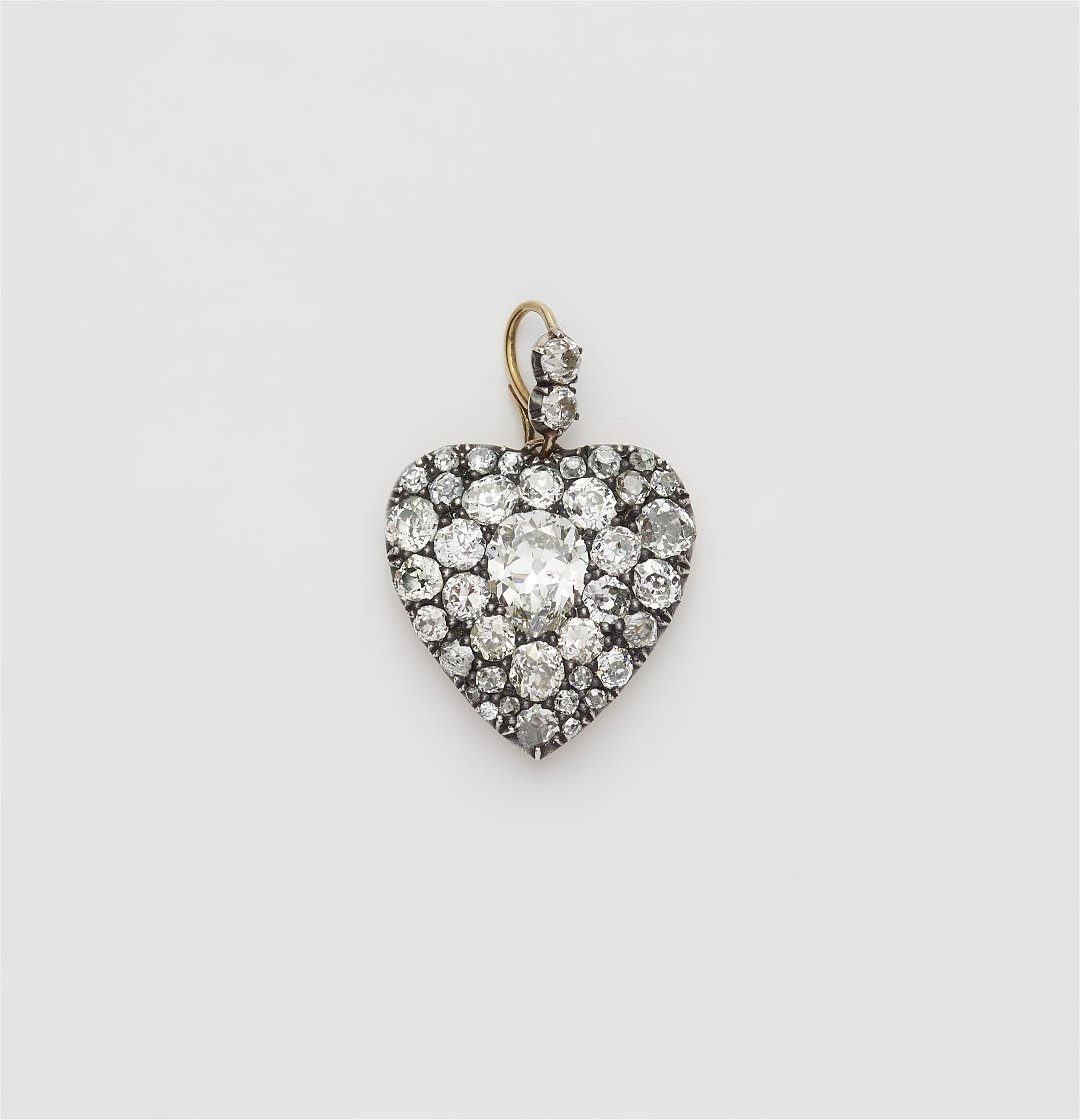 A Victorian silver 18k gold and diamond heart locket. - image-1