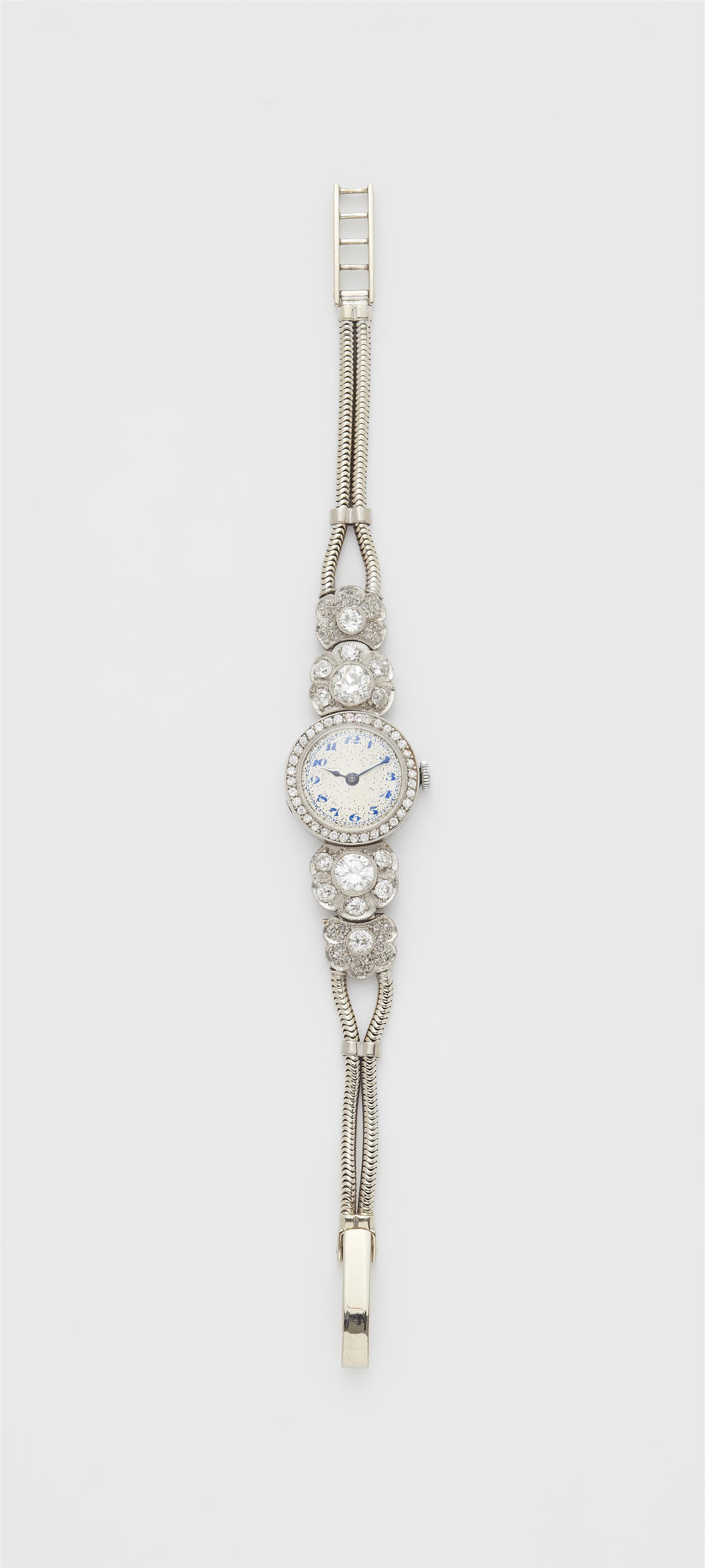 A platinum and diamond Art Déco ladies wristwatch with 18k gold tubogaz bracelet. - image-1