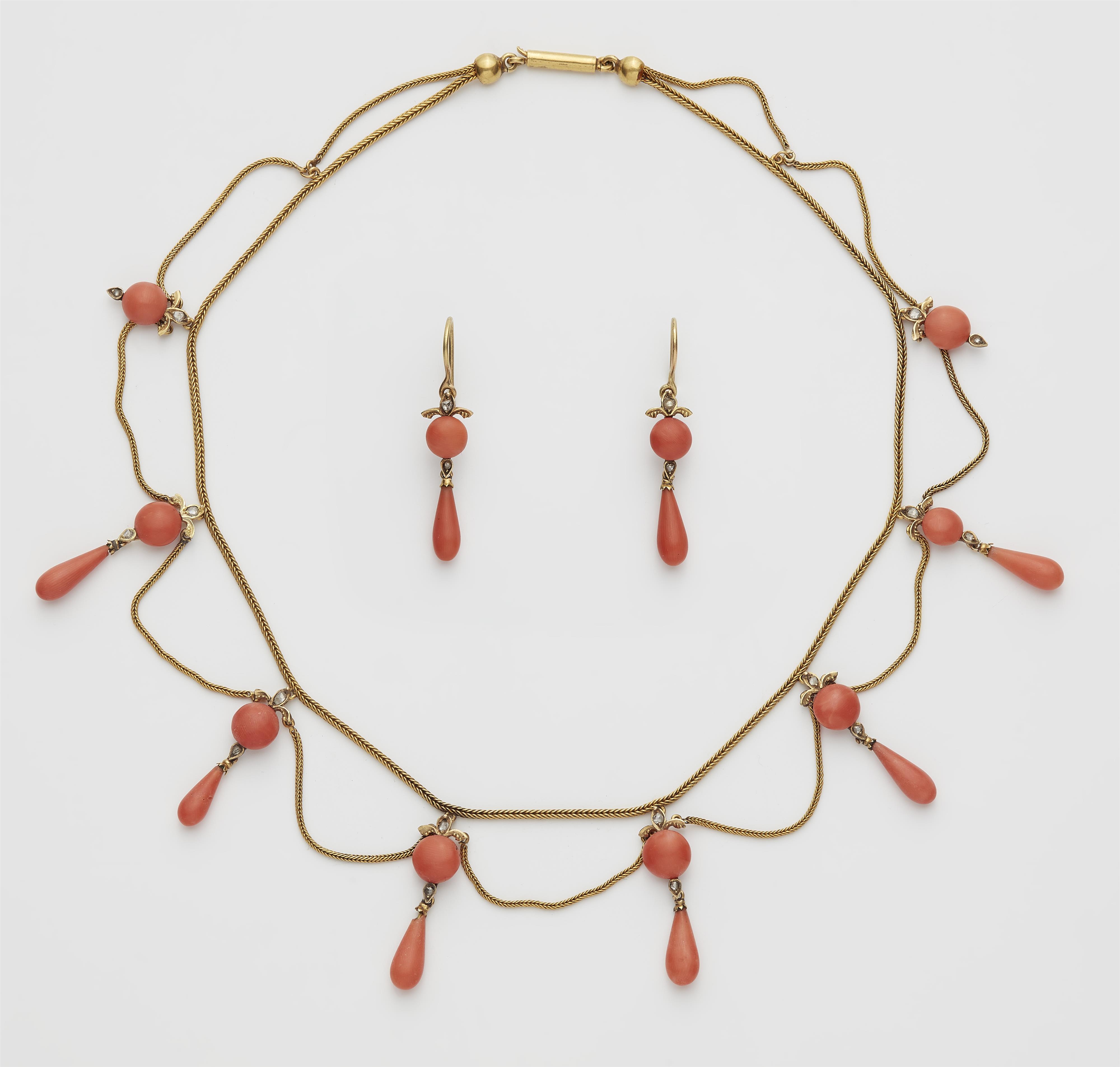 An Austrian 14k gold diamond and coral demiparure comprising a garland necklace and a pair of earrings. - image-1
