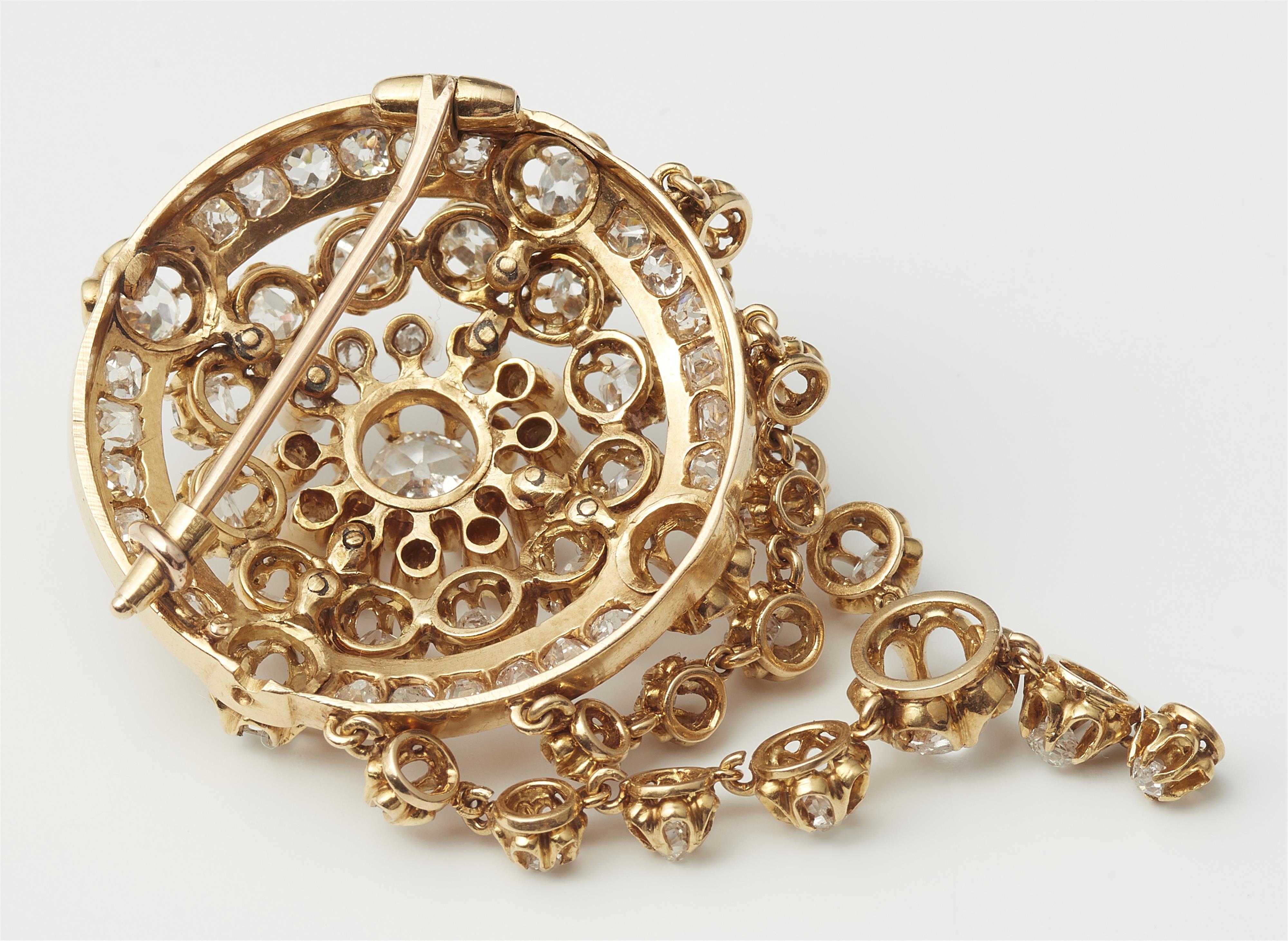 An 18k gold and diamond cluster brooch with festoons. - image-2