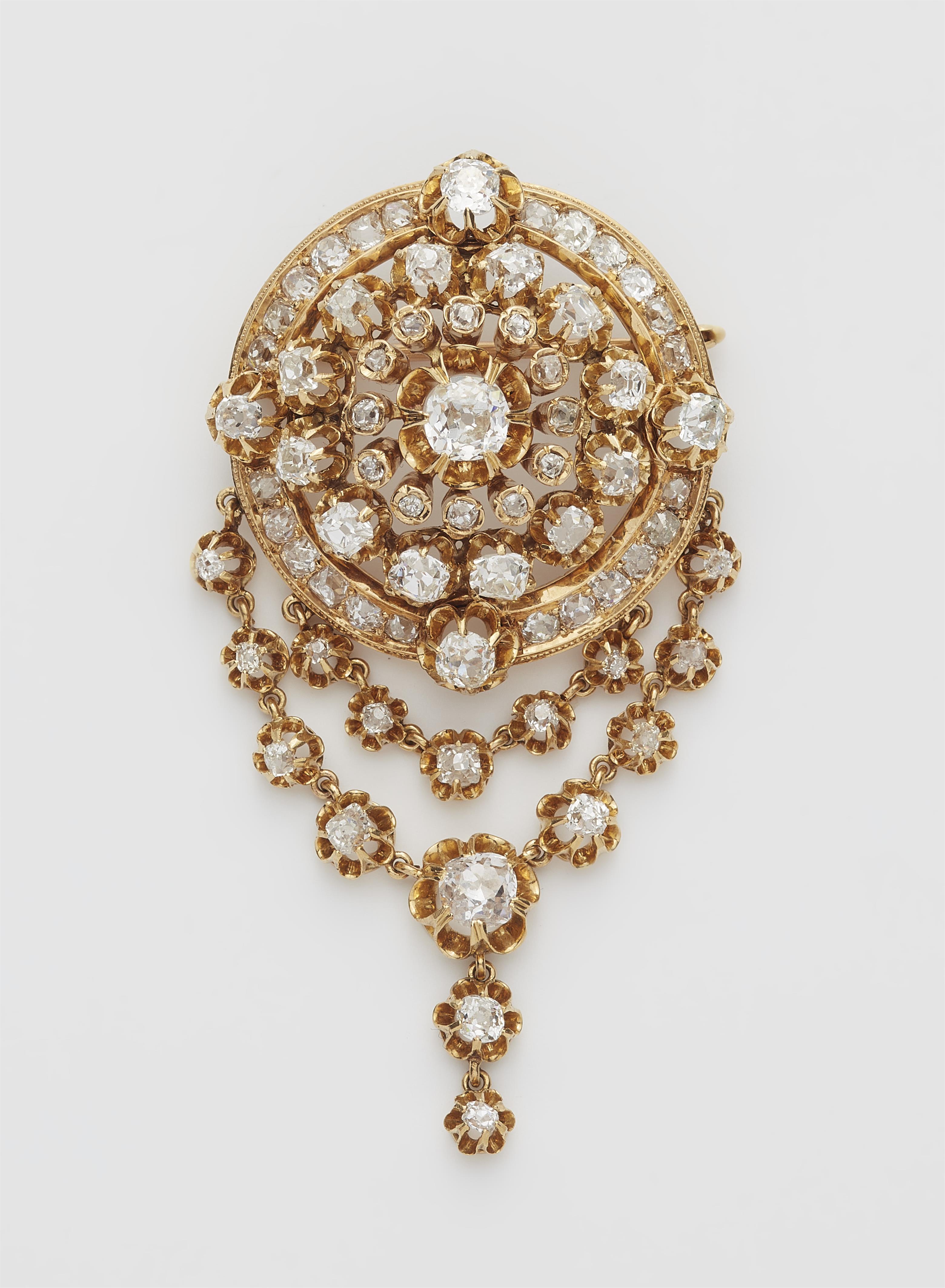 An 18k gold and diamond cluster brooch with festoons. - image-1