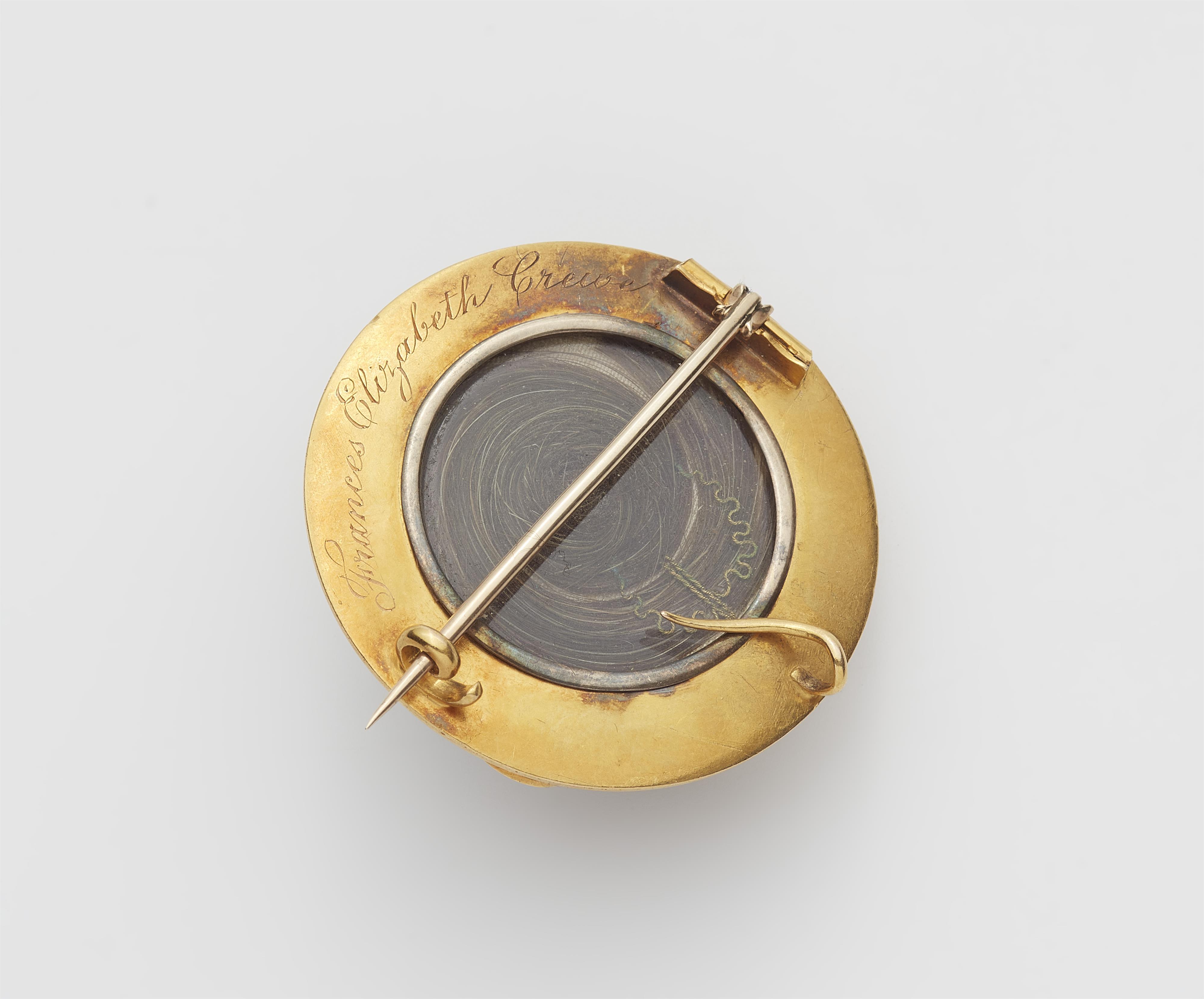 A Victorian 14k gold black enamel and pearl memory brooch with a large banded onyx cabochon. - image-2