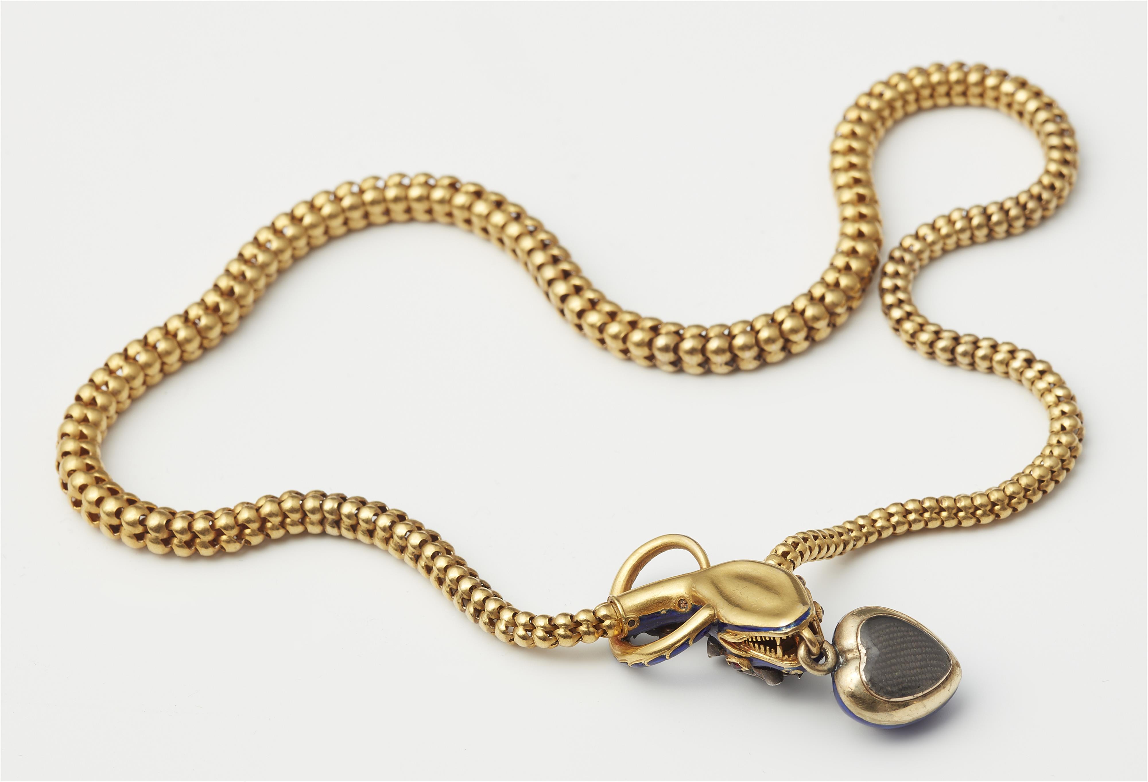 A Victorian flexible 18k gold tubogaz blue enamel and diamond necklace with snake head and heart locket. - image-2