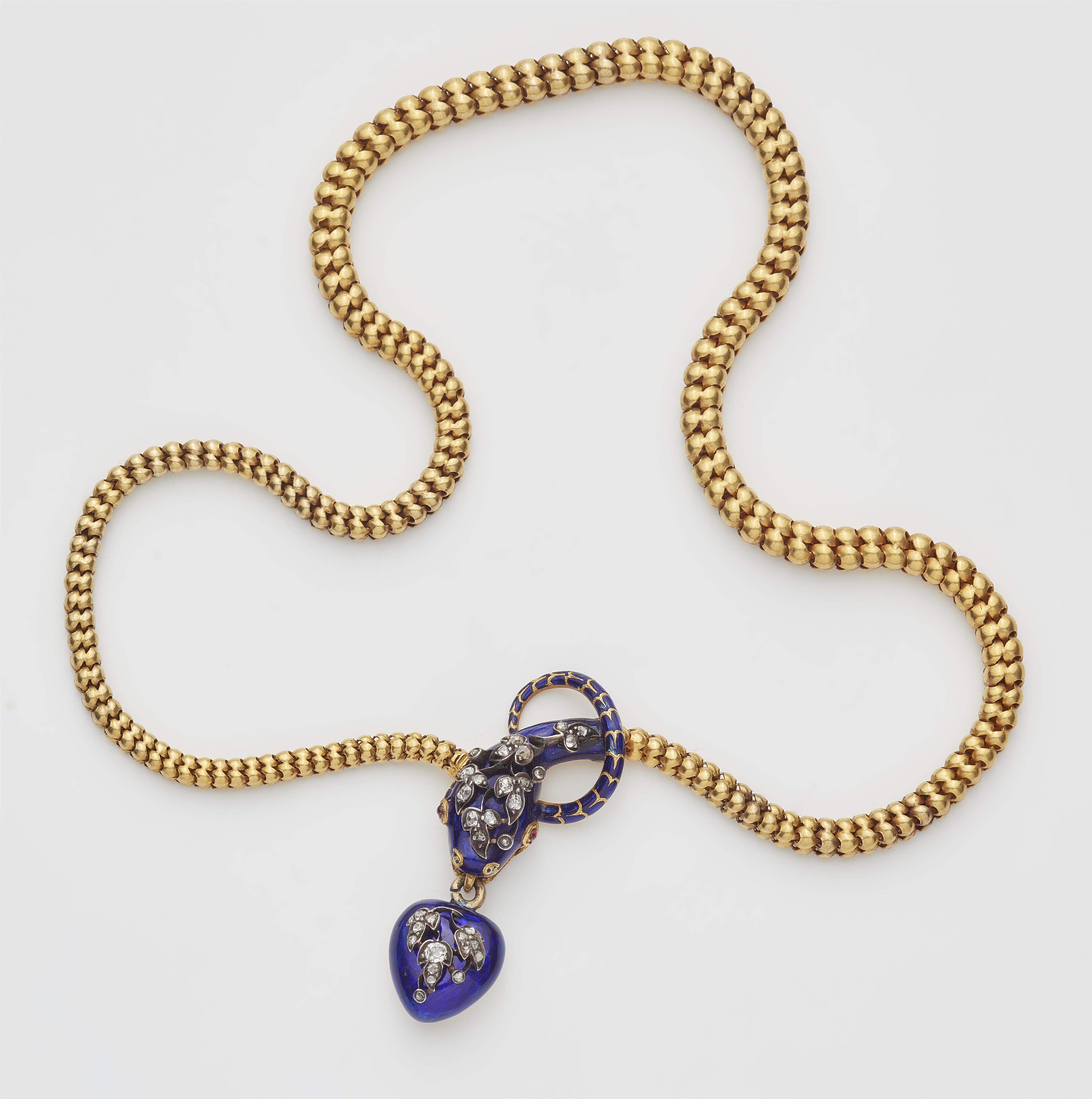 A Victorian flexible 18k gold tubogaz blue enamel and diamond necklace with snake head and heart locket. - image-1
