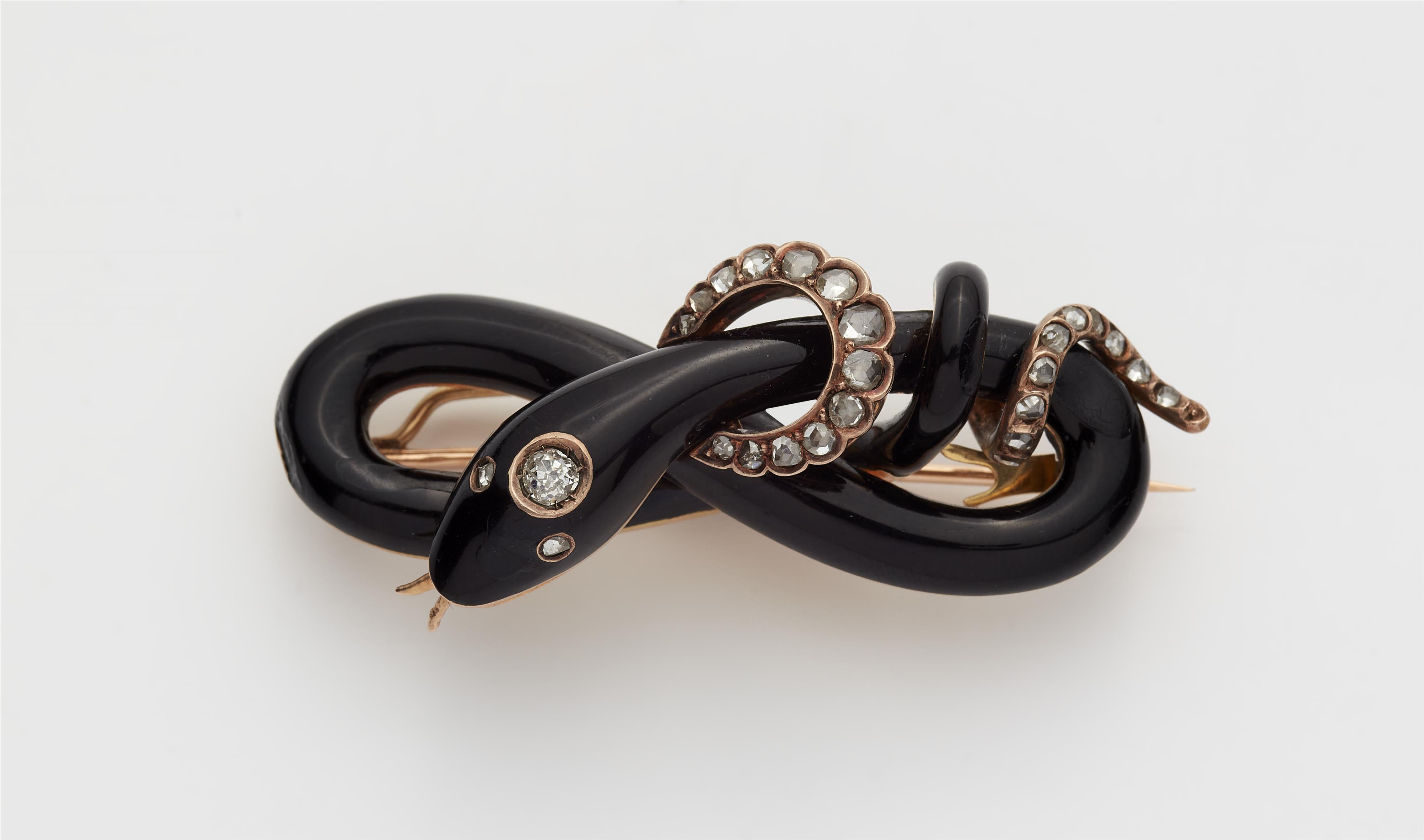 A late 19th century 14k gold black enamel and diamond snake brooch. - image-1