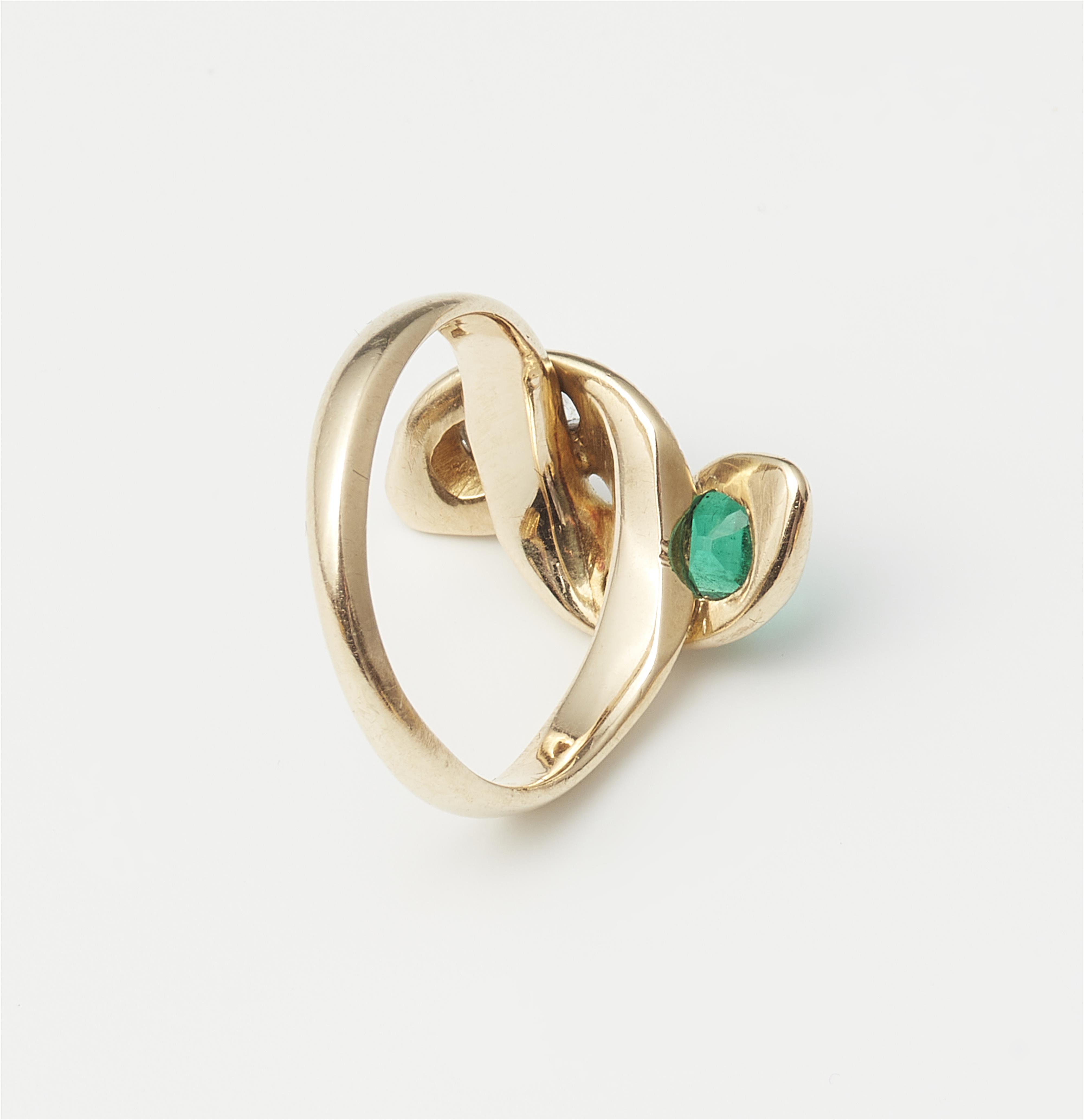 A 14k gold diamond and Columbian emerald snake ring. - image-2
