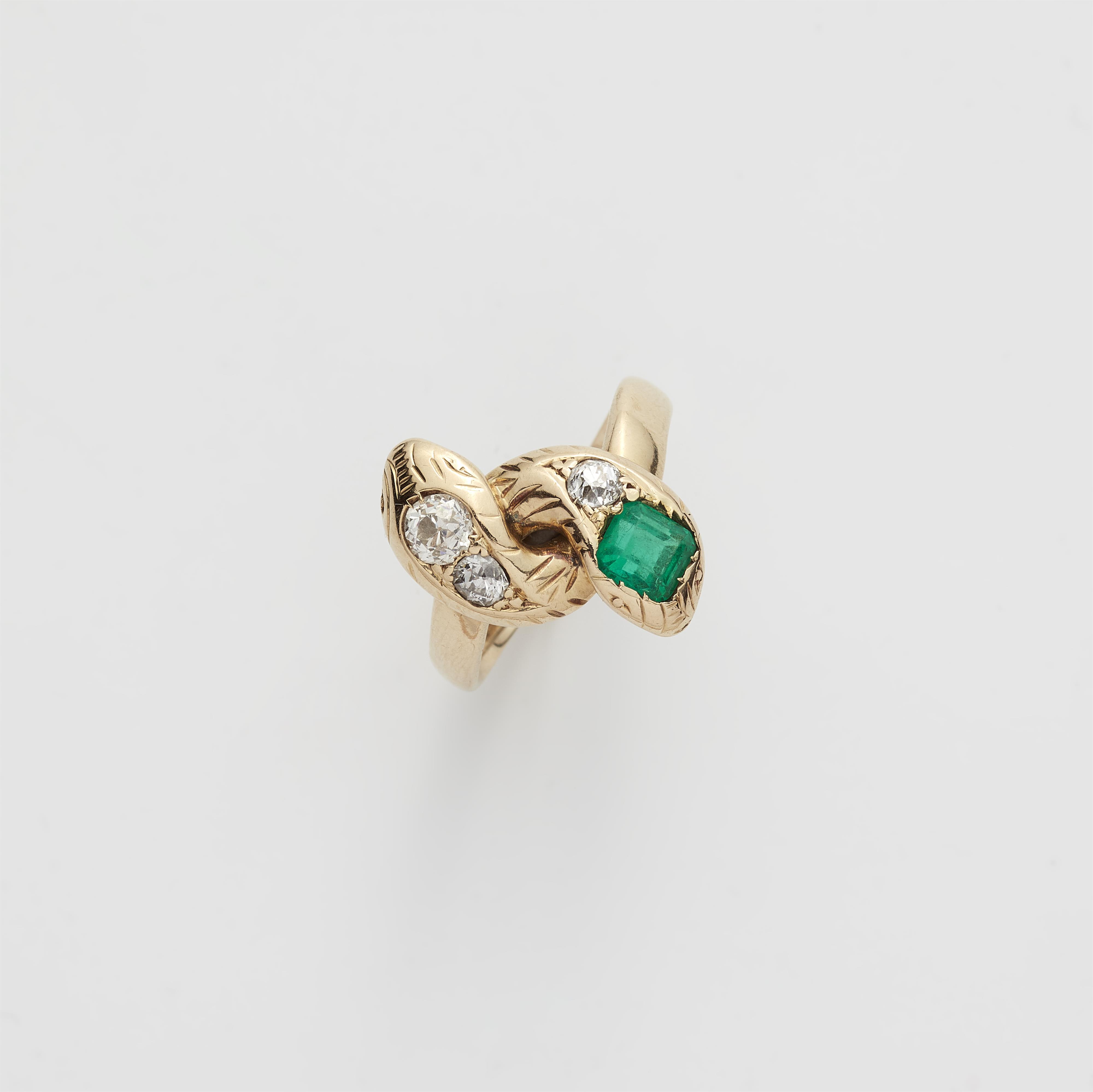 A 14k gold diamond and Columbian emerald snake ring. - image-1