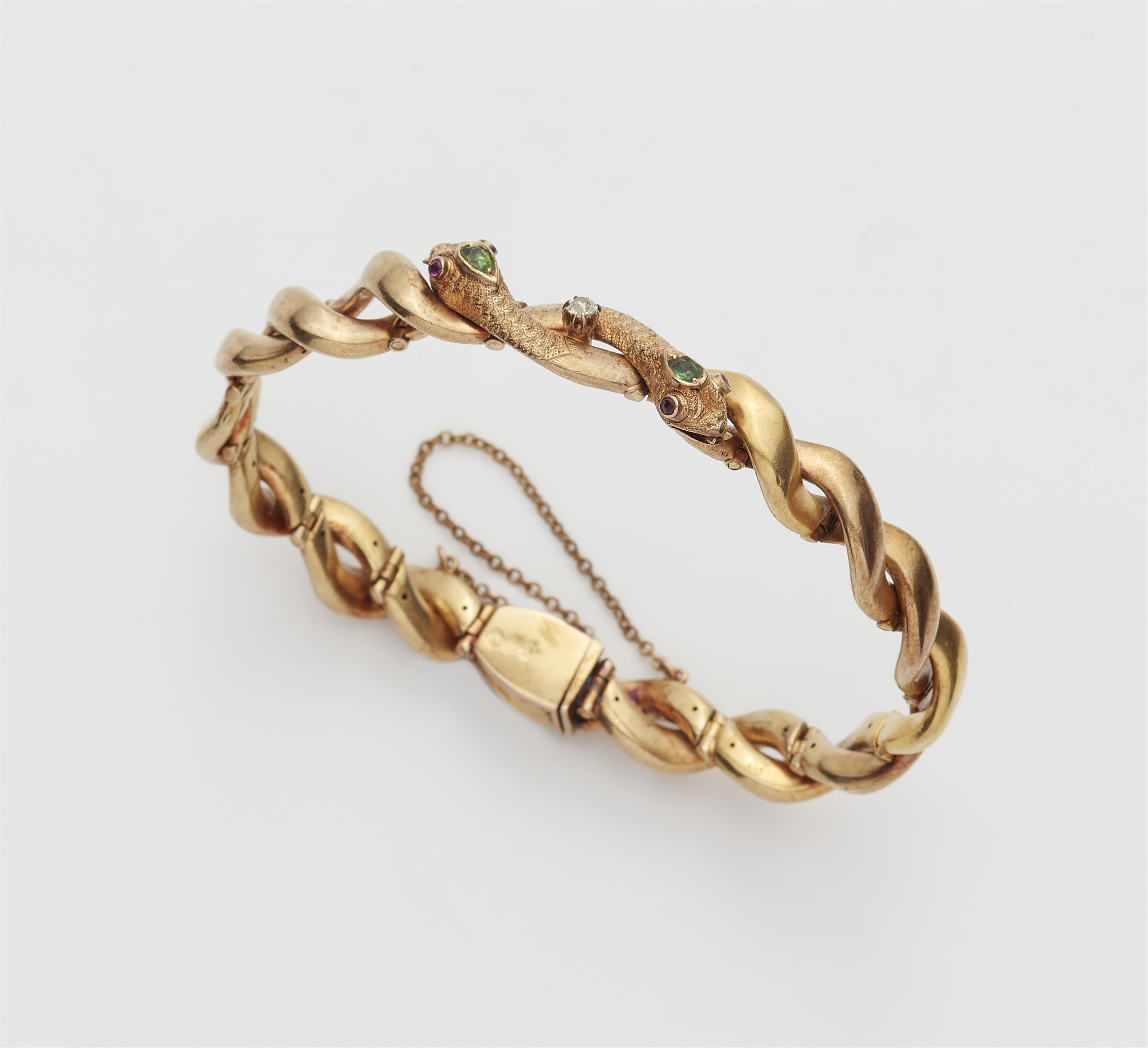 A late Victorian 18k gold peridot and ruby snake bracelet. - image-1