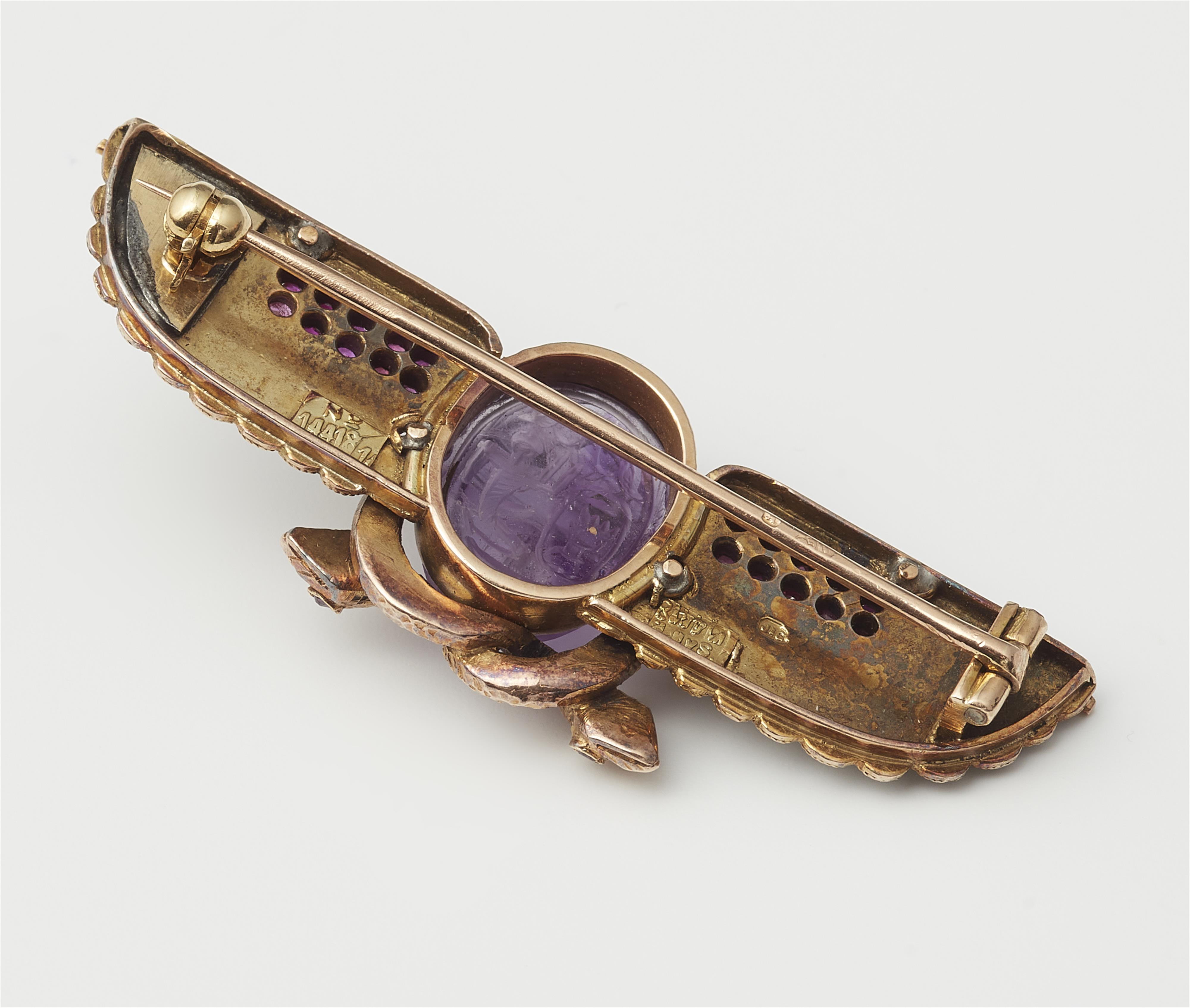 An Austrian Egyptian Revival 14k gold enamel diamond ruby and amethyst winged scarab brooch. - image-2