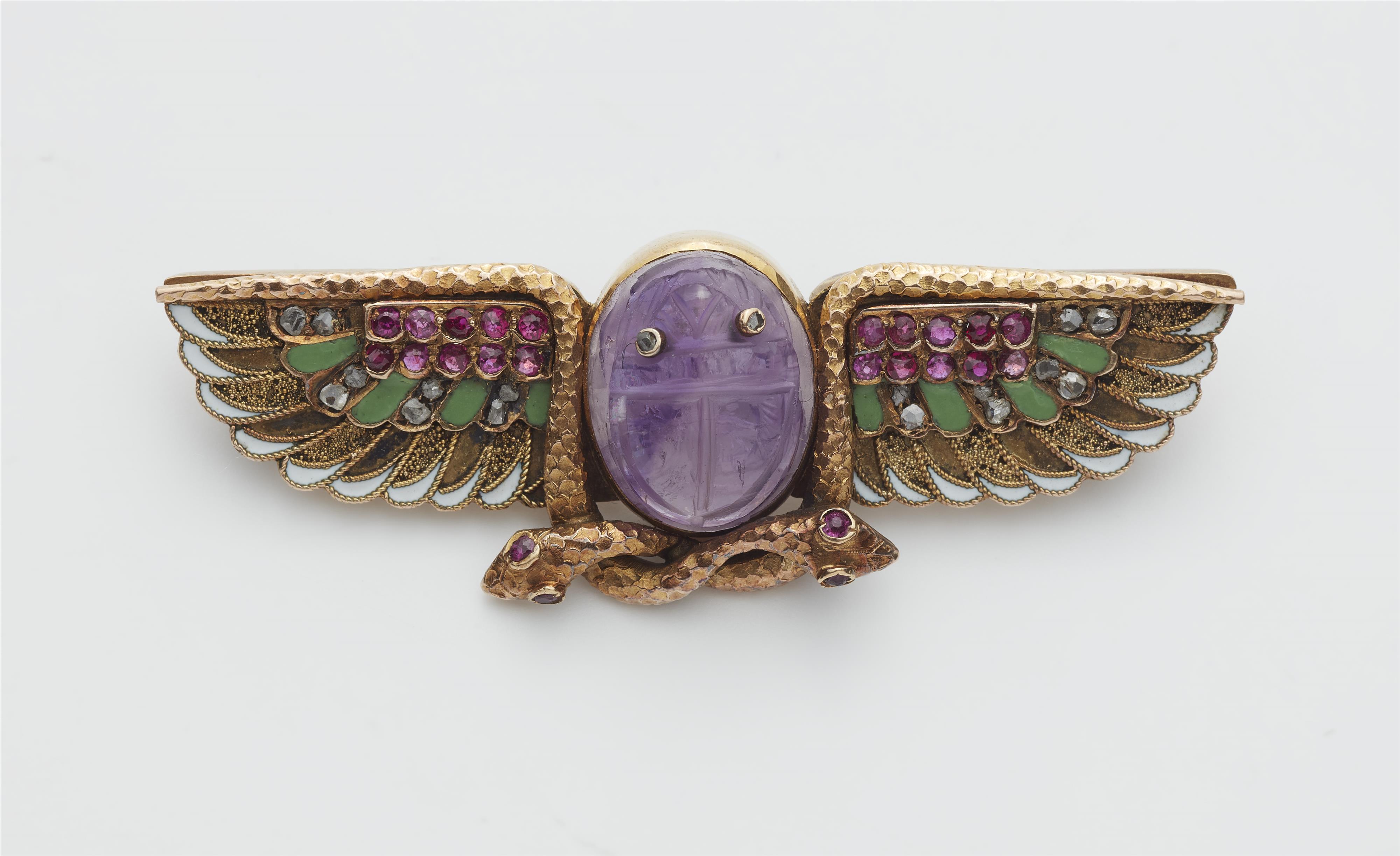 An Austrian Egyptian Revival 14k gold enamel diamond ruby and amethyst winged scarab brooch. - image-1